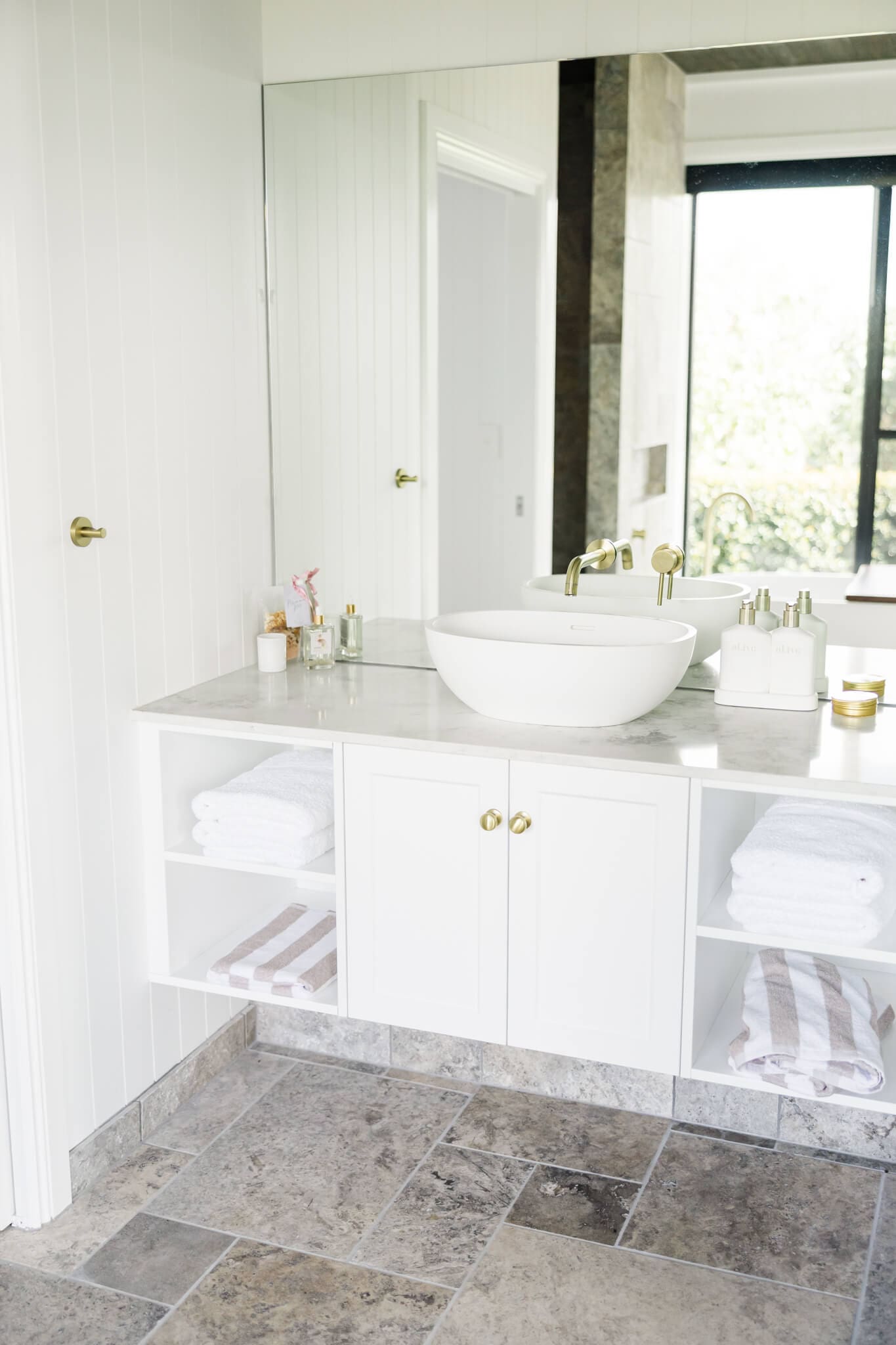 Basin and bath area in the honeymoon suite at Ambrym Estate in Yeppoon, Queensland.