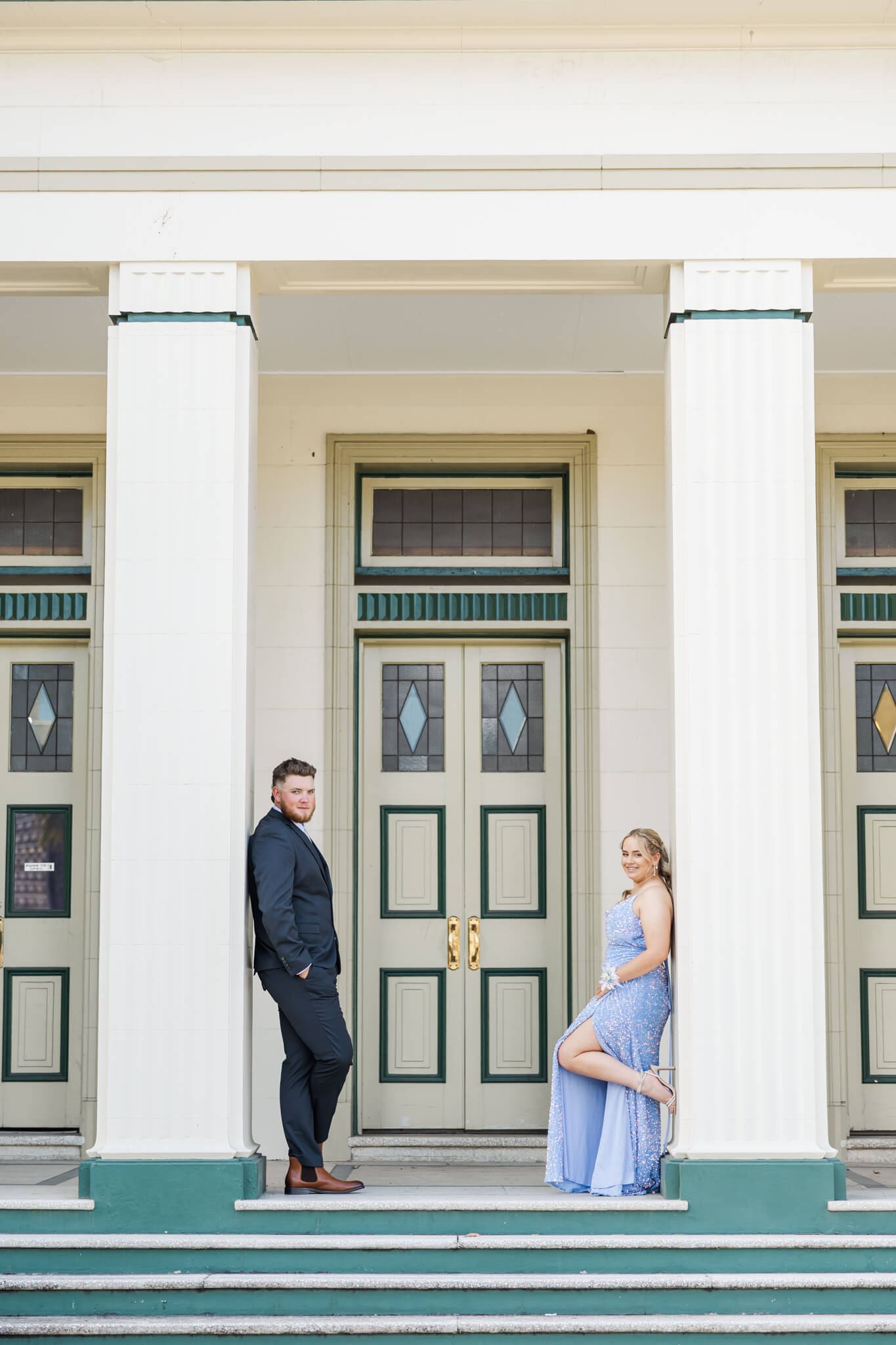 Stunning formal photo in Rockhampton of girl in sky blue dress with her partner in a navy suit. Captured by Julie-Anne Photography.