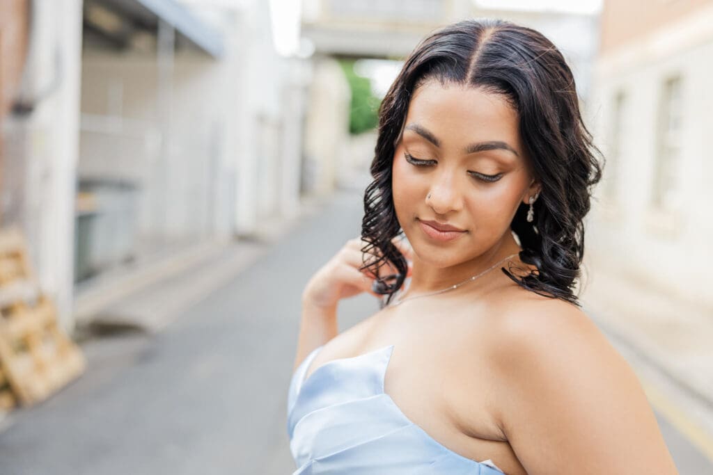 Beautiful photo of a girl dressed in a sky blue formal dress by Runway 7 Boutique. Photographed by Julie-Anne Photography.
