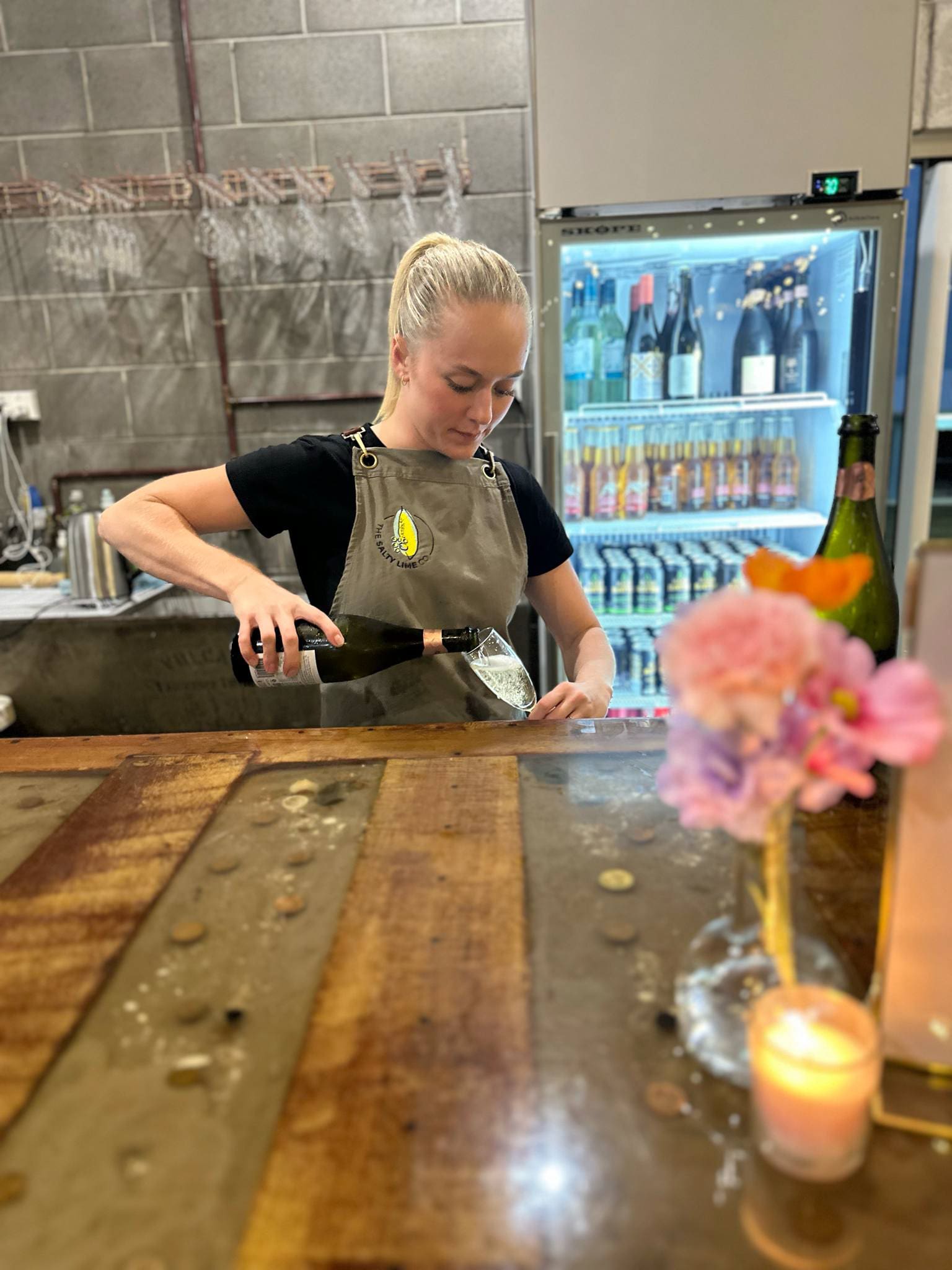 Waitress pouring drinks at a wedding venue