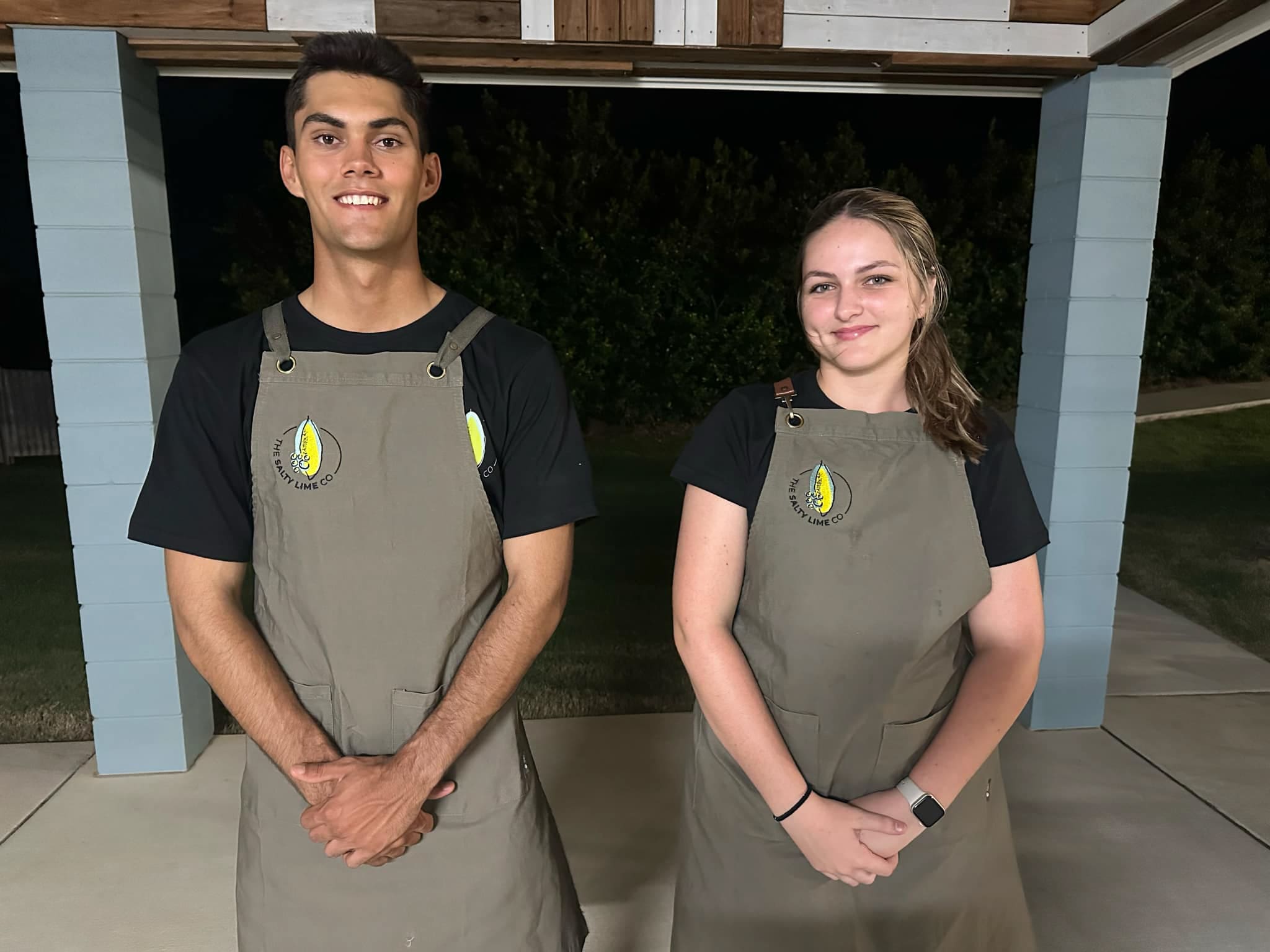 Two team members of a coastal wedding venue