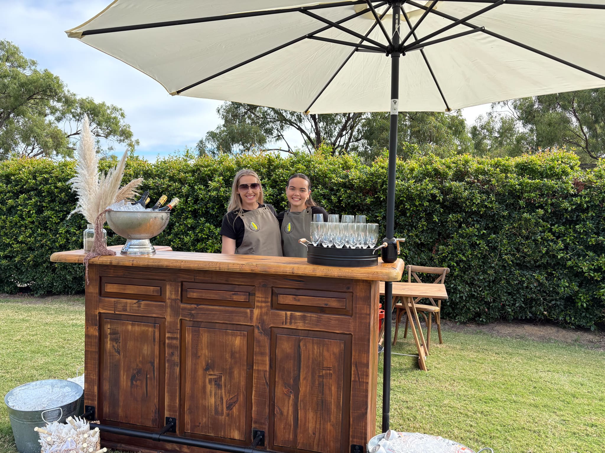 Two ladies manning the drinks bar at the Salty Lime Co.