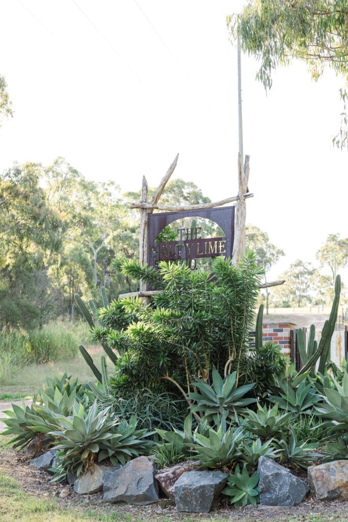 Sign hidden amongst greenery at local wedding venue near Emu Park, Queensland