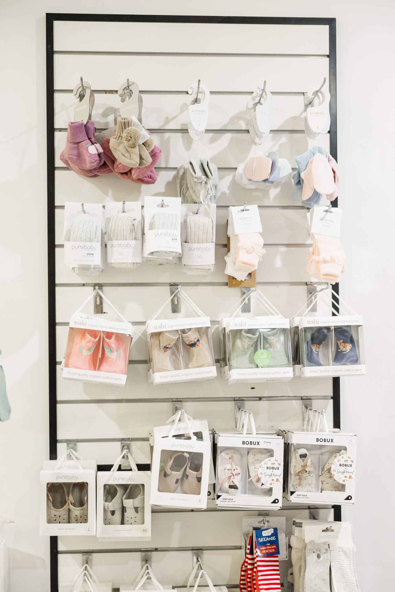 Rack of baby socks on display in the baby store - Two Little Friends.