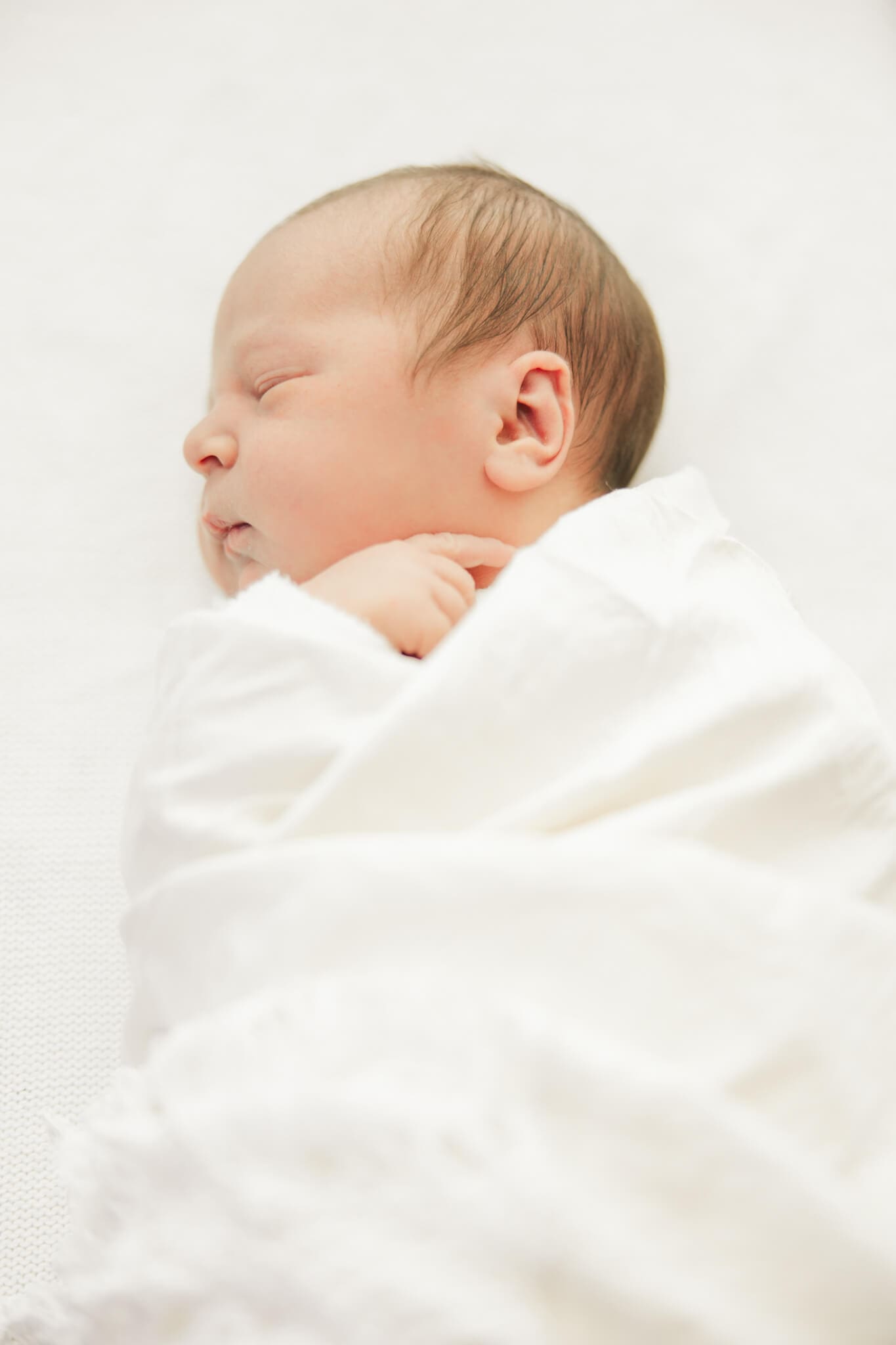 Cute baby photo wrapped in cream blanket, captured by Julie-Anne Photography.
