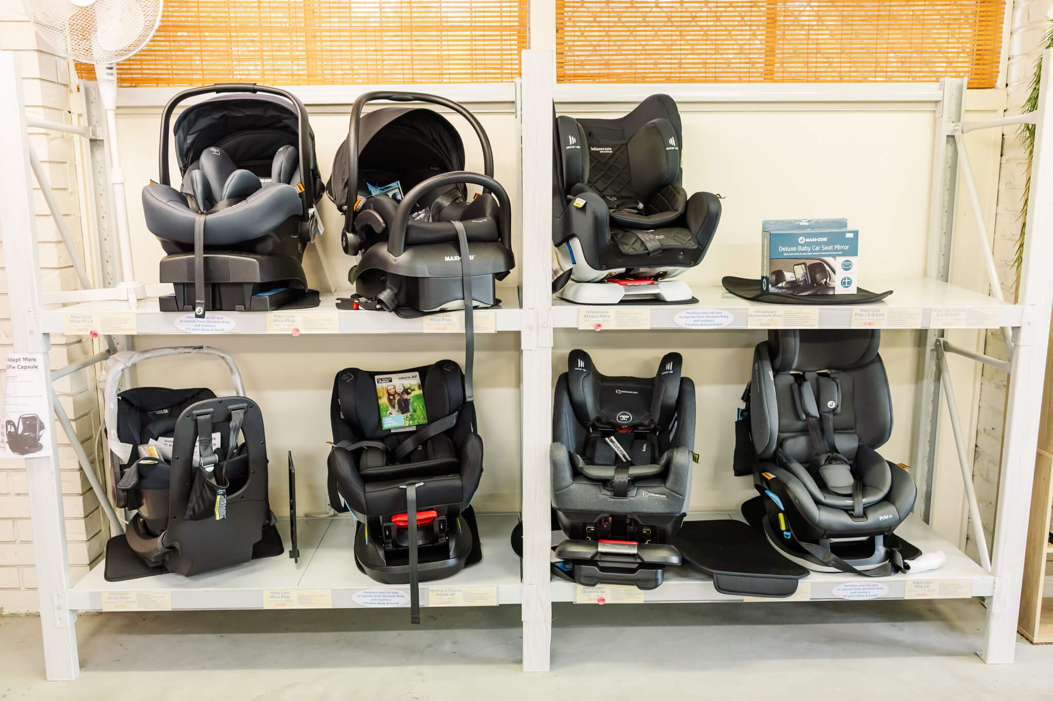 Some stock in a baby shop in Rockhampton featuring car seats.
