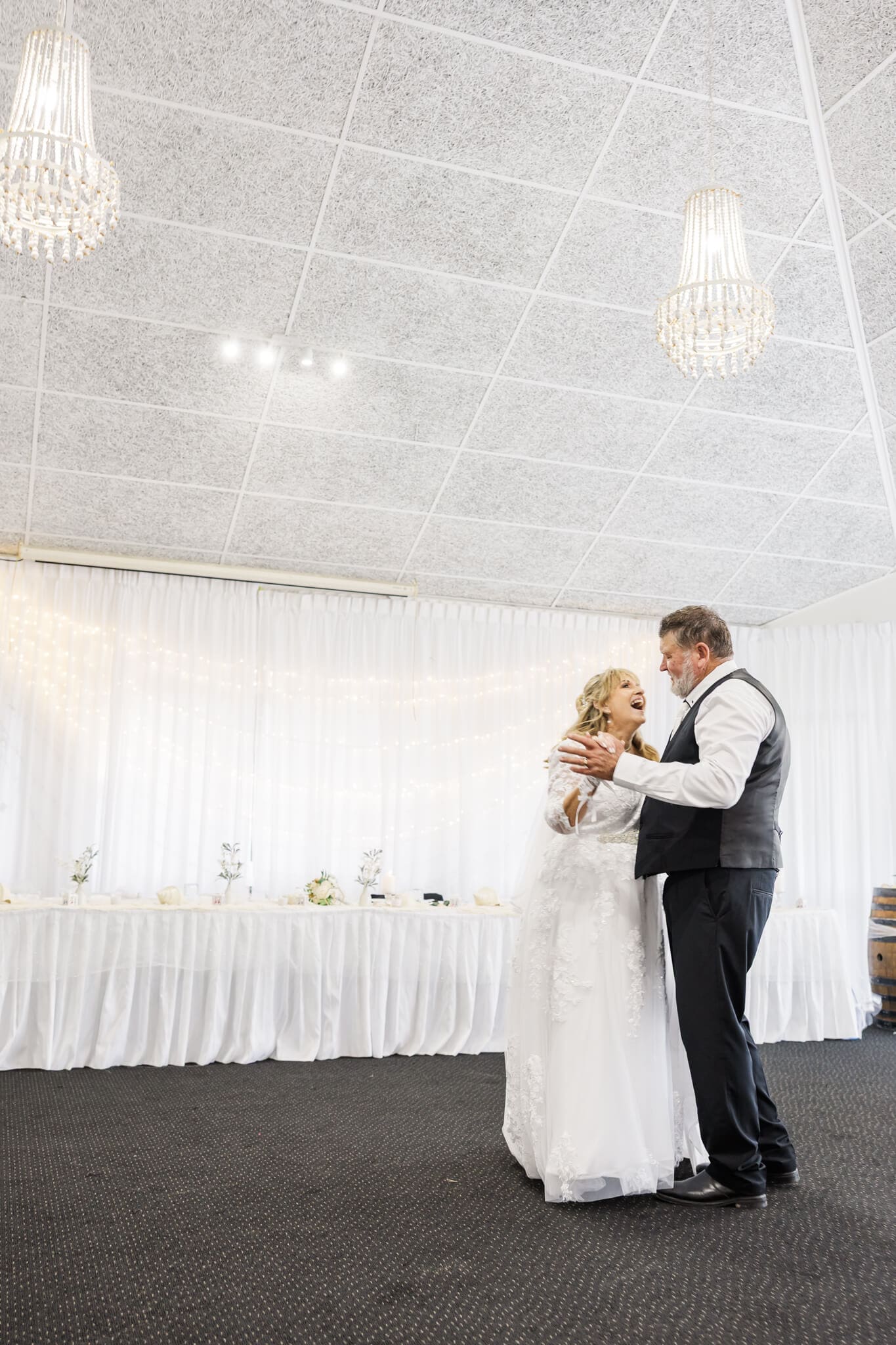 Bride and groom dance at their wedding reception at a Yeppoon Wedding  venue. 