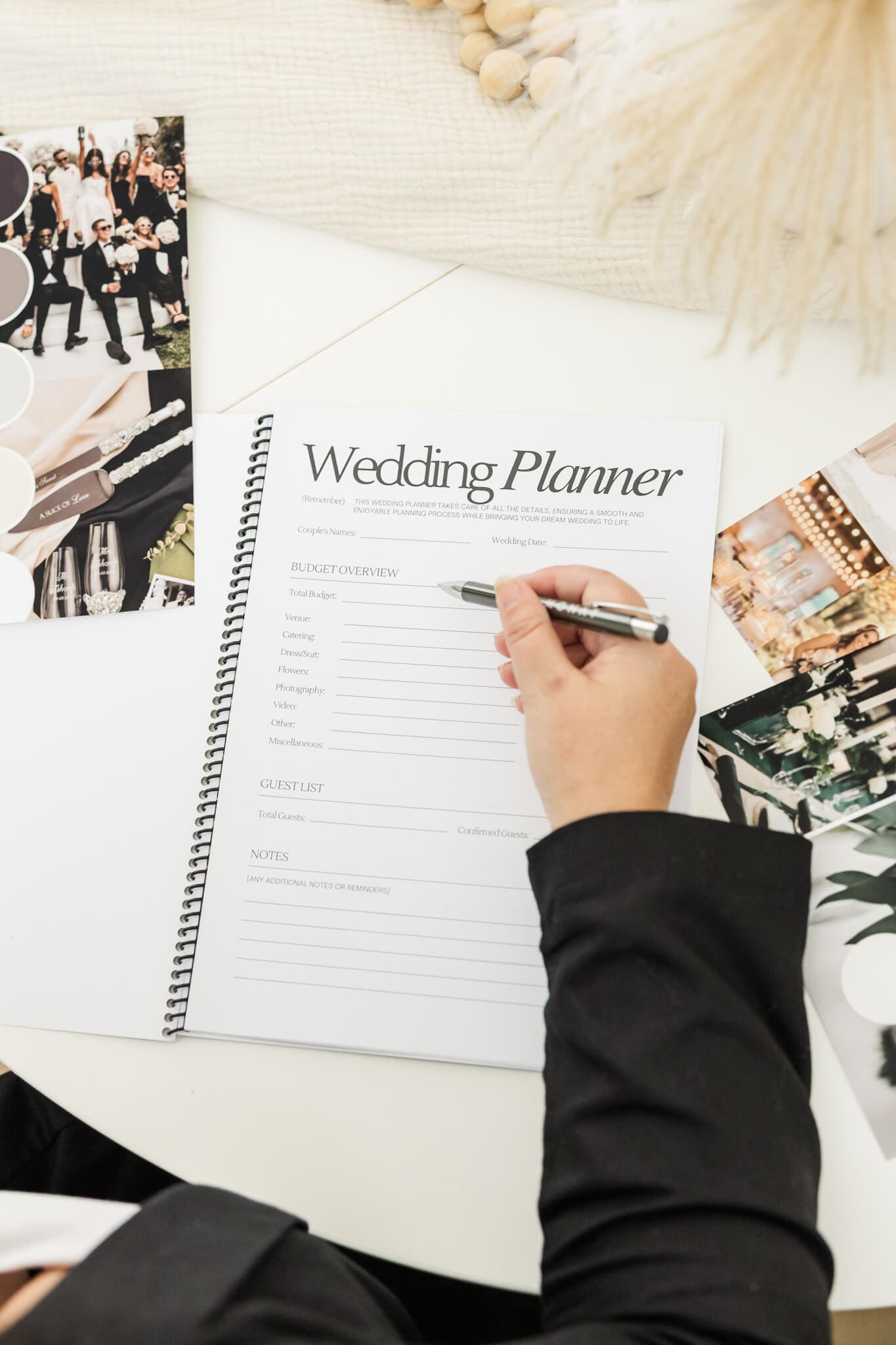 A photo of a wedding planner's questionnaire. Hand showing with a pen, ready to write down answers.