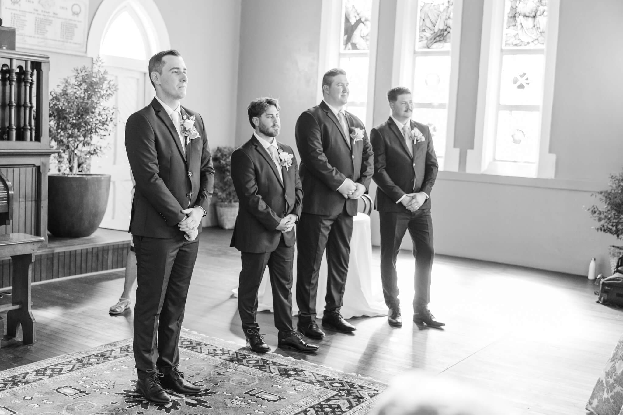 Groom and his groomsmen await the arrival of his bride at the Church Events Venue in Rockhampton.