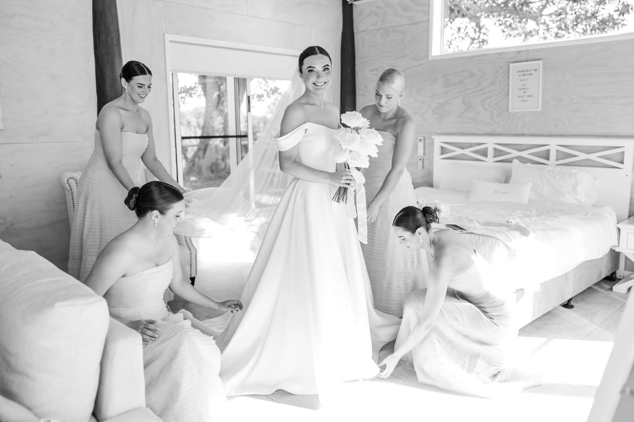 Stunning bride portraits of beautiful bride prepares for her wedding with her 4 bridesmaids dressed in blue, in the Hilltop Chalet at The Woodbury Lookout wedding venue near Yeppoon. Captured by Julie-Anne Photography.