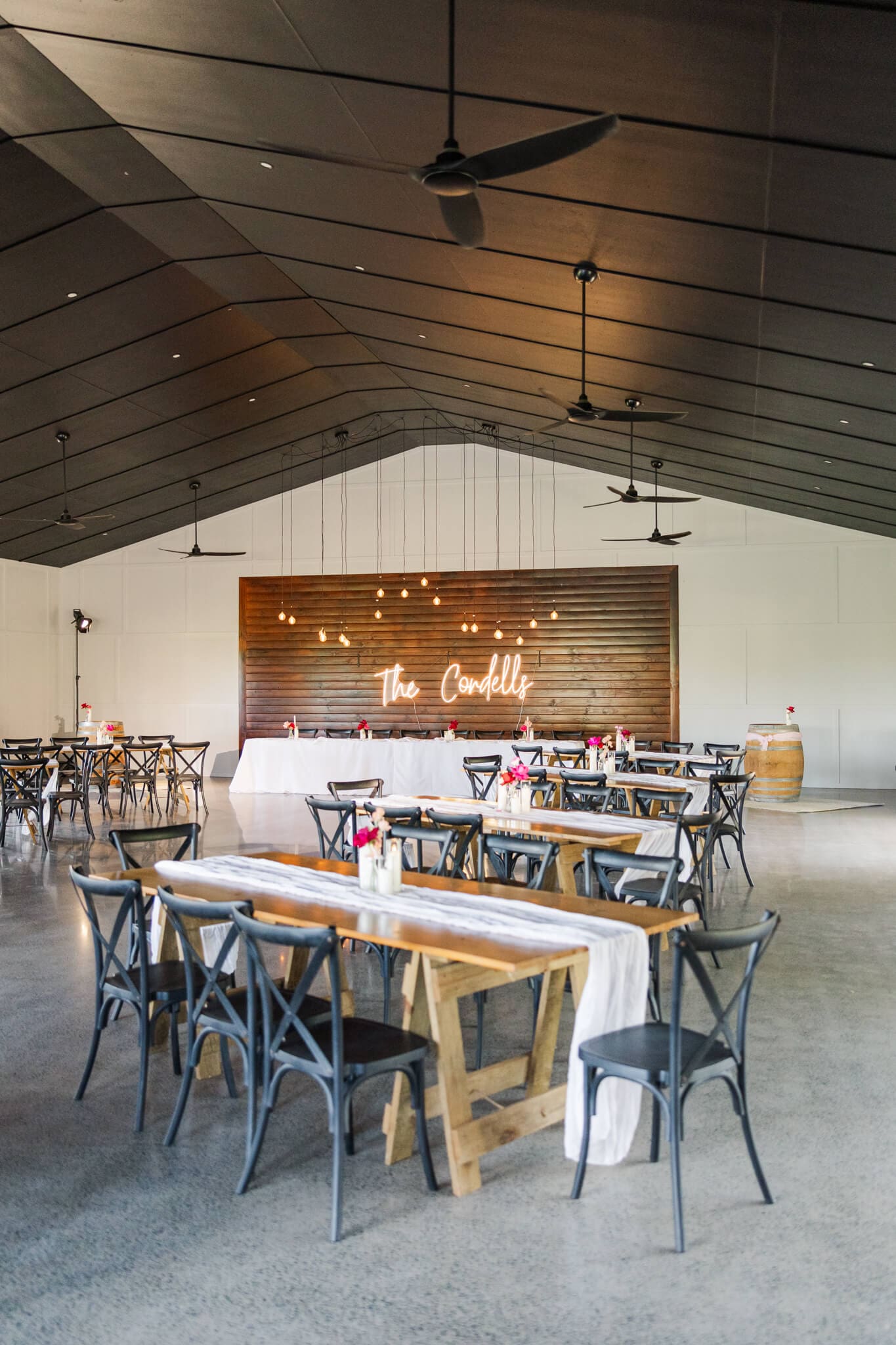 Inside the venue at The Orchard Yeppoon, looking over a set up wedding reception.