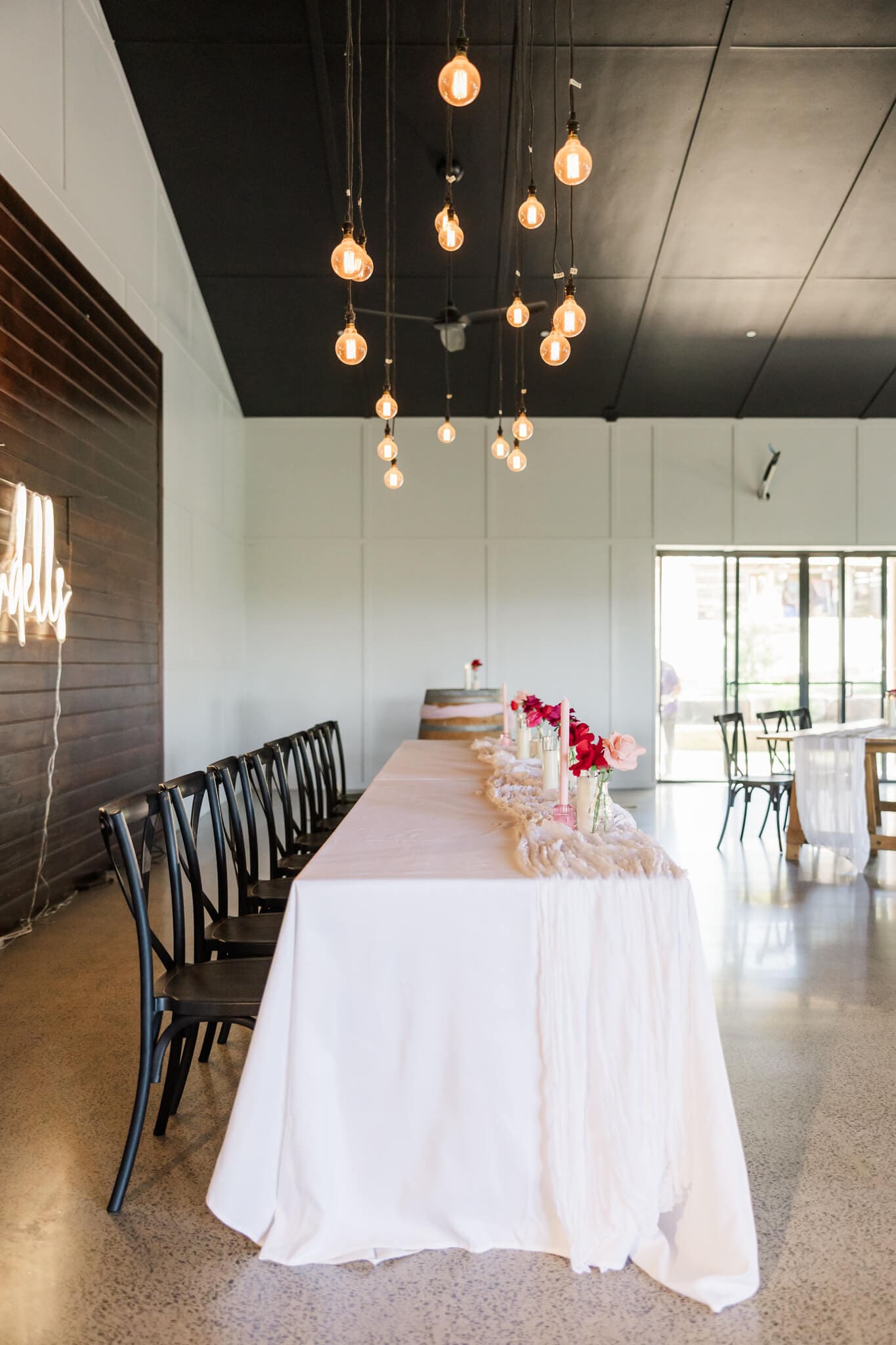 Inside the venue at The Orchard Yeppoon, looking over a set up wedding reception.