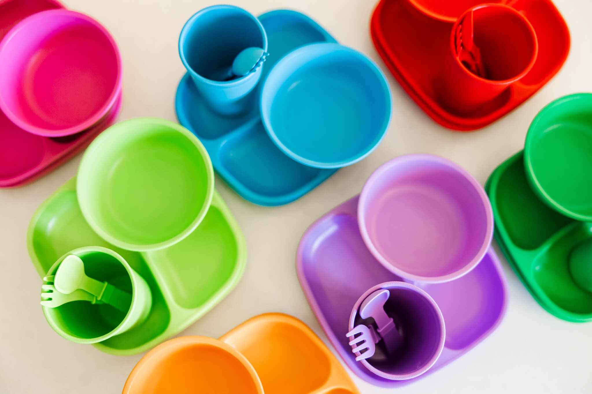 Colourful tableware designed for toddlers, sold at Two Little Finches.