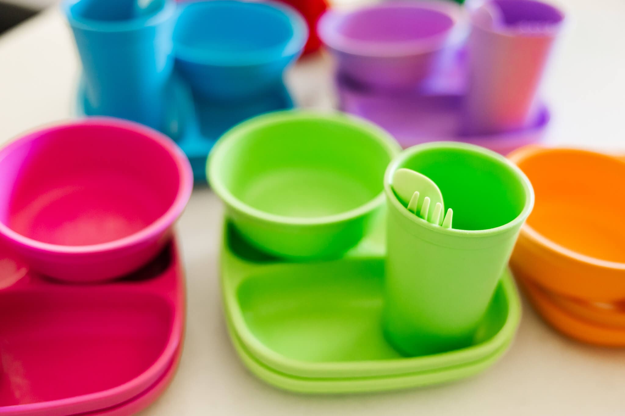 Colourful tableware designed for toddlers, sold at Two Little Finches.