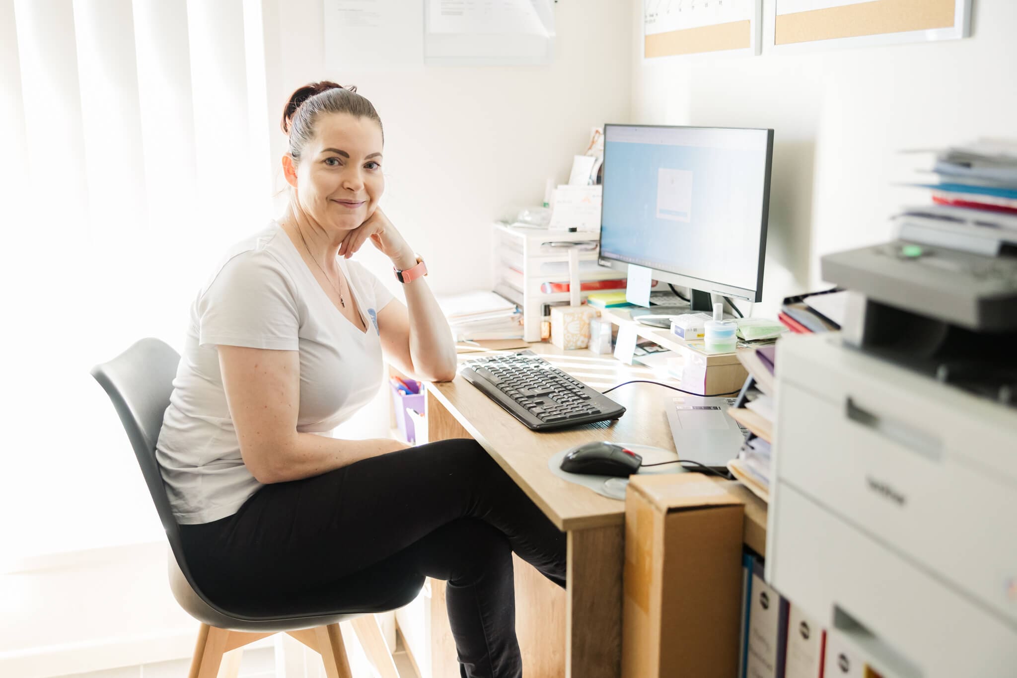 Jess from Two Little Finches, mum and business owner at her office desk