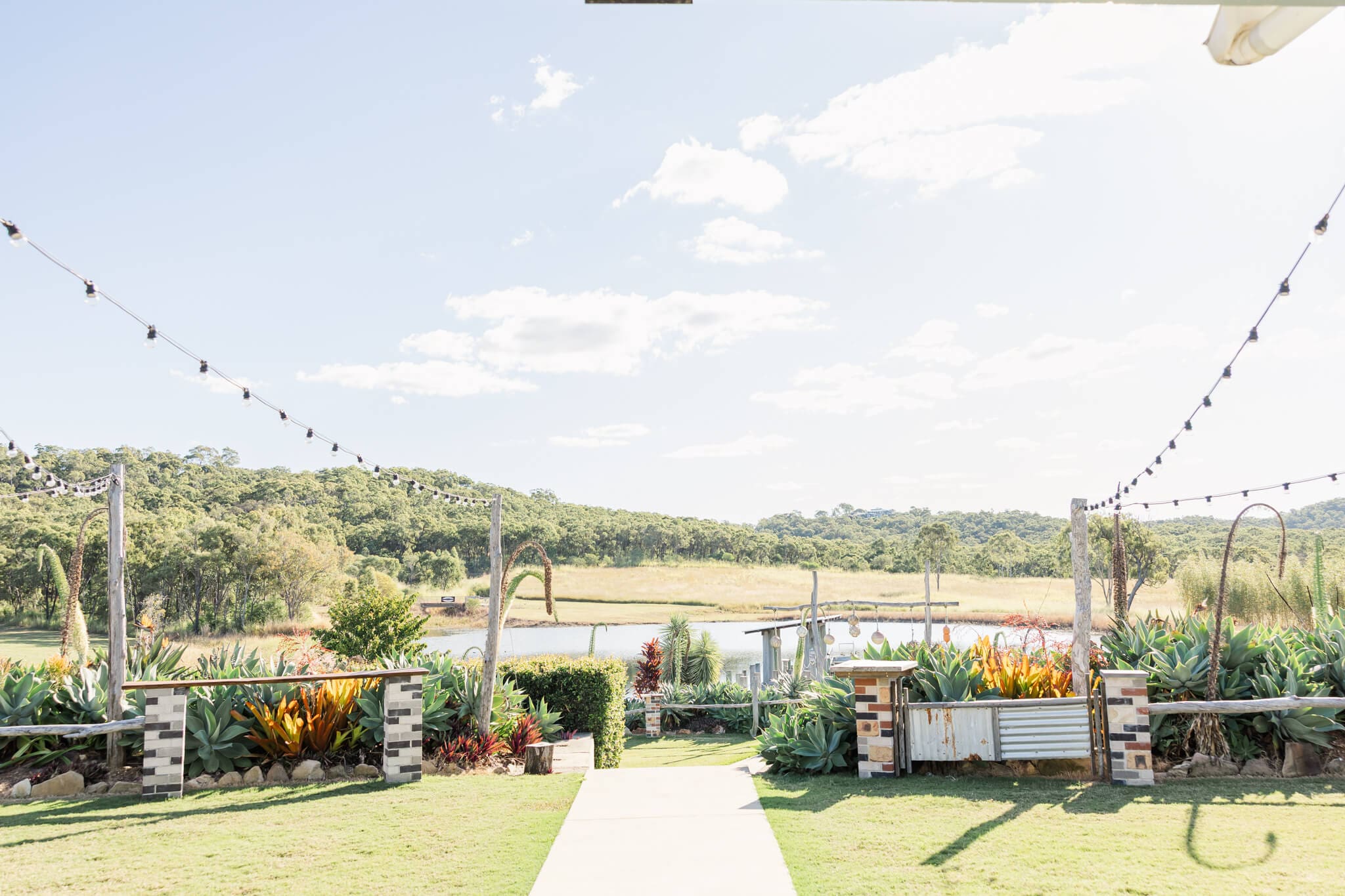 The gorgeous jetty over the lake at The Salty Lime Co., a Yeppoon wedding venue.
