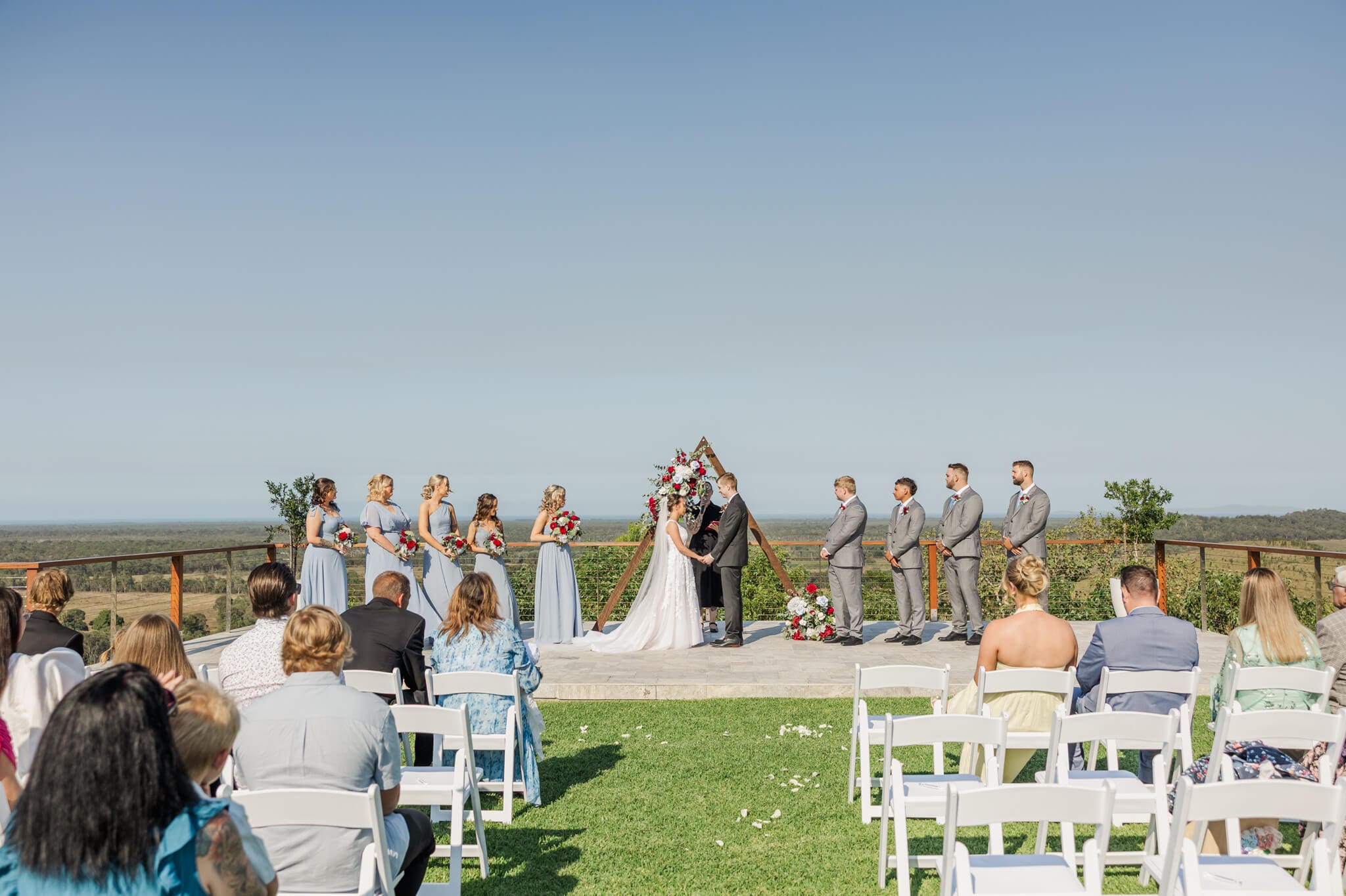 Wedding ceremony against a gorgeous view at Ambrym Estate Yeppoon.