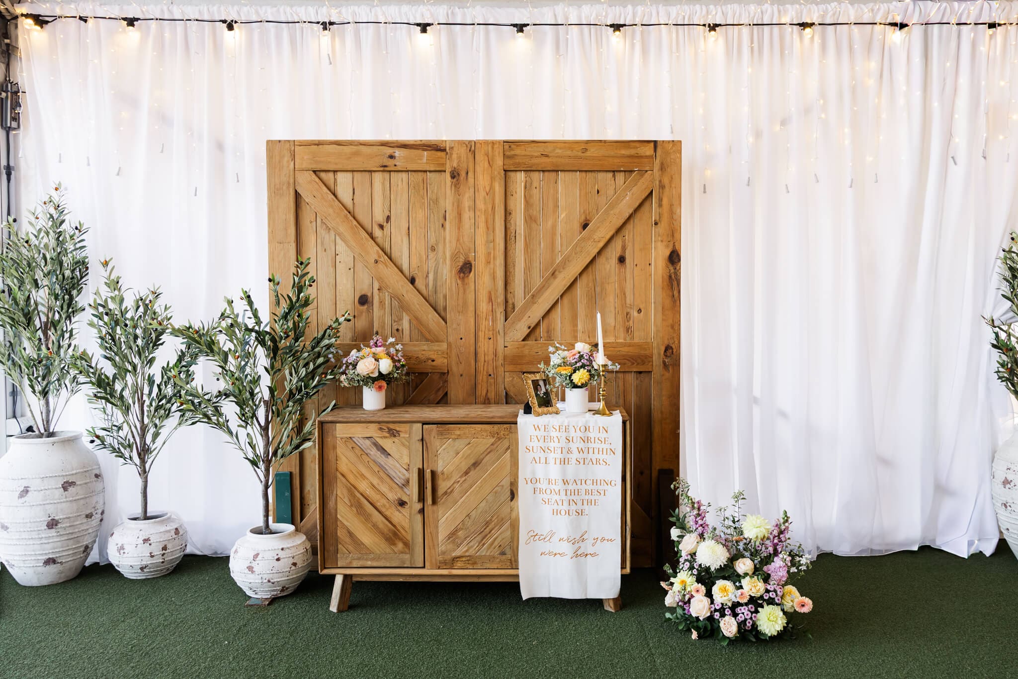 Decor at the reception are in the white marquee at The Paddock Yeppoon, a luxury wedding venu.