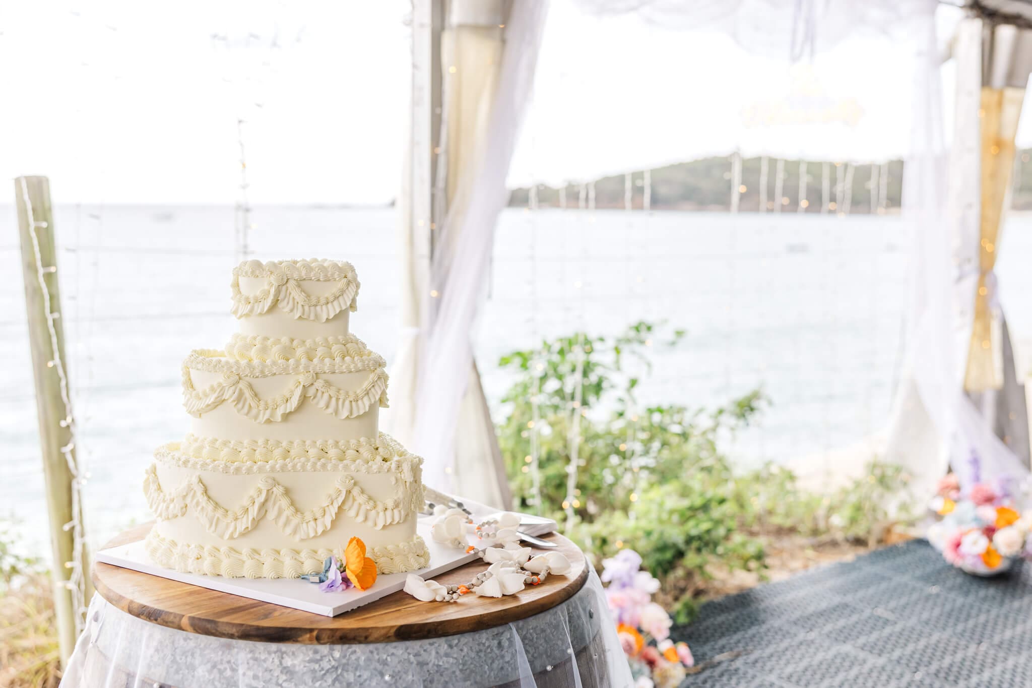 Stunning wedding cake in front of the ocean view at Great Keppel Island.