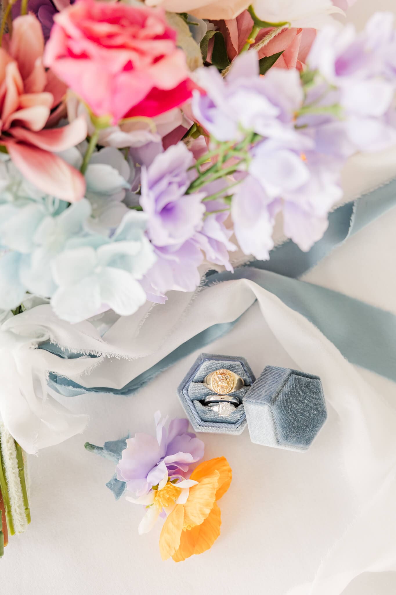 Detail shots of bride and grooms wedding rings.