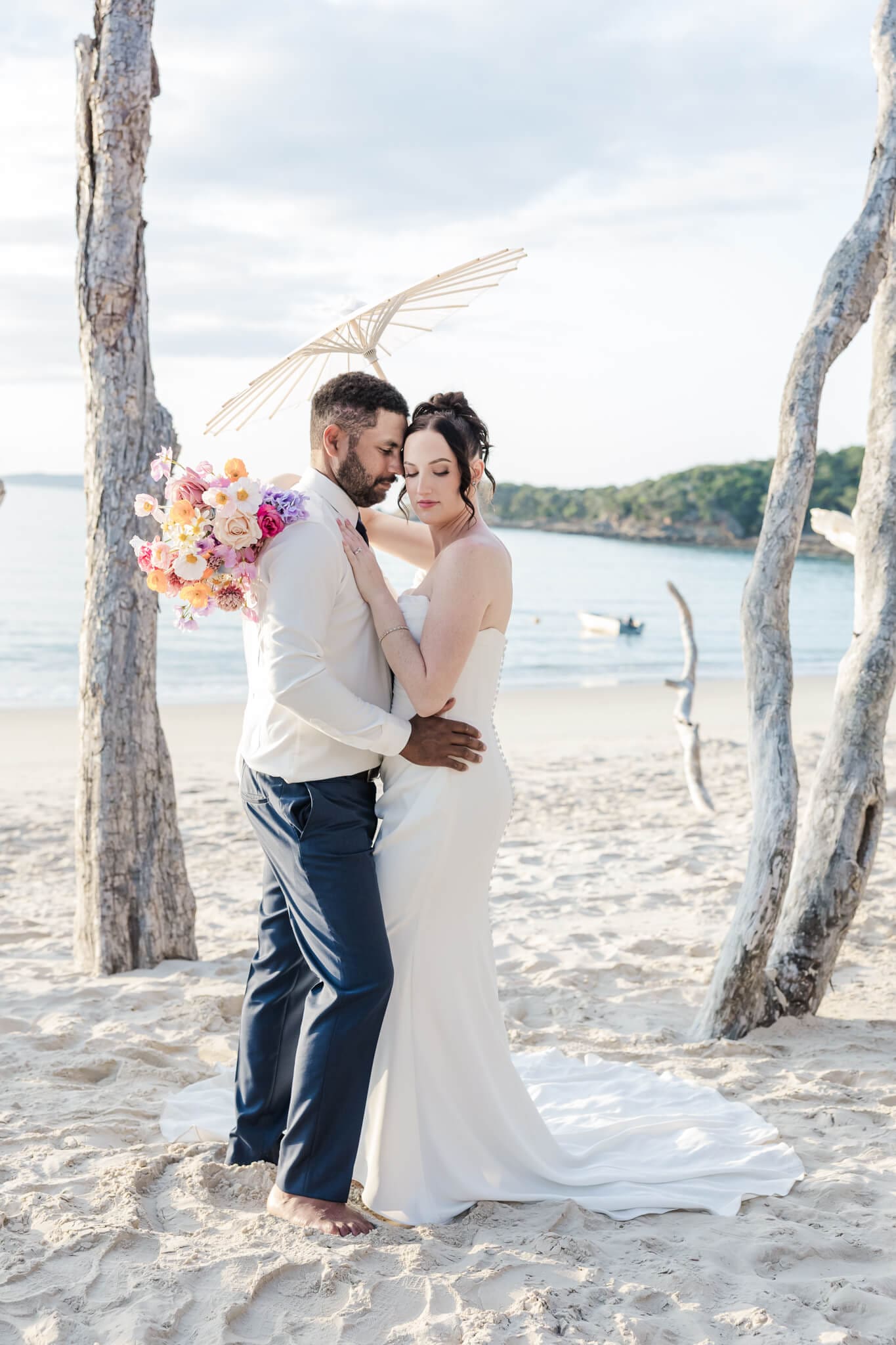 Bride and Groom share a moment on Great Keppel Island during their wedding day. Pictured in front of one of the beaches near Great Keppel Island Hideaway.