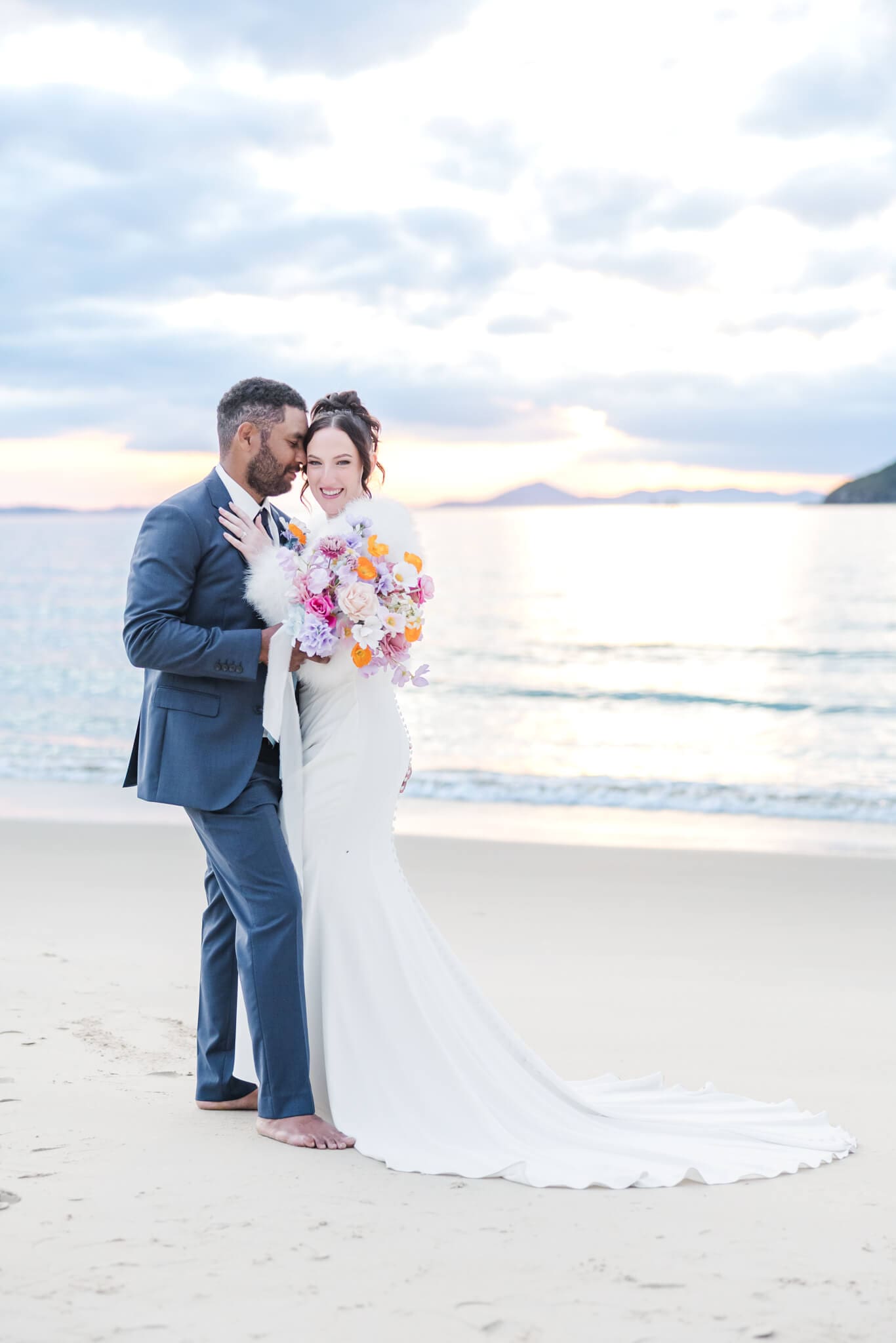 Bride and Groom share a moment on Great Keppel Island during their wedding day. Pictured in front of one of the beaches near Great Keppel Island Hideaway.