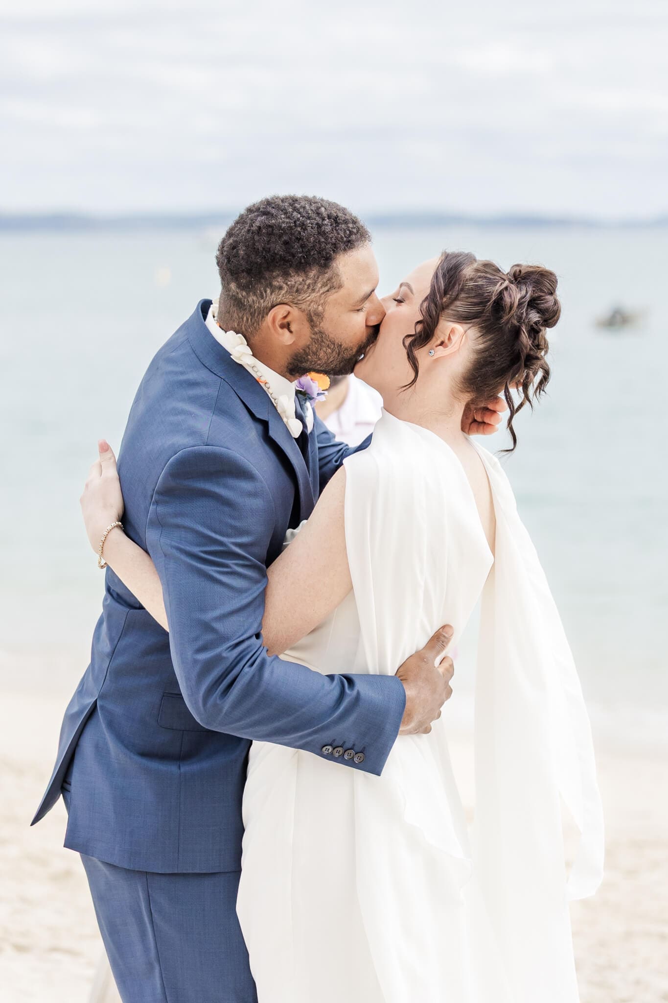Bride and groom kiss as husband and wife. Located at Great Keppel Island Hideaway, Queensland.