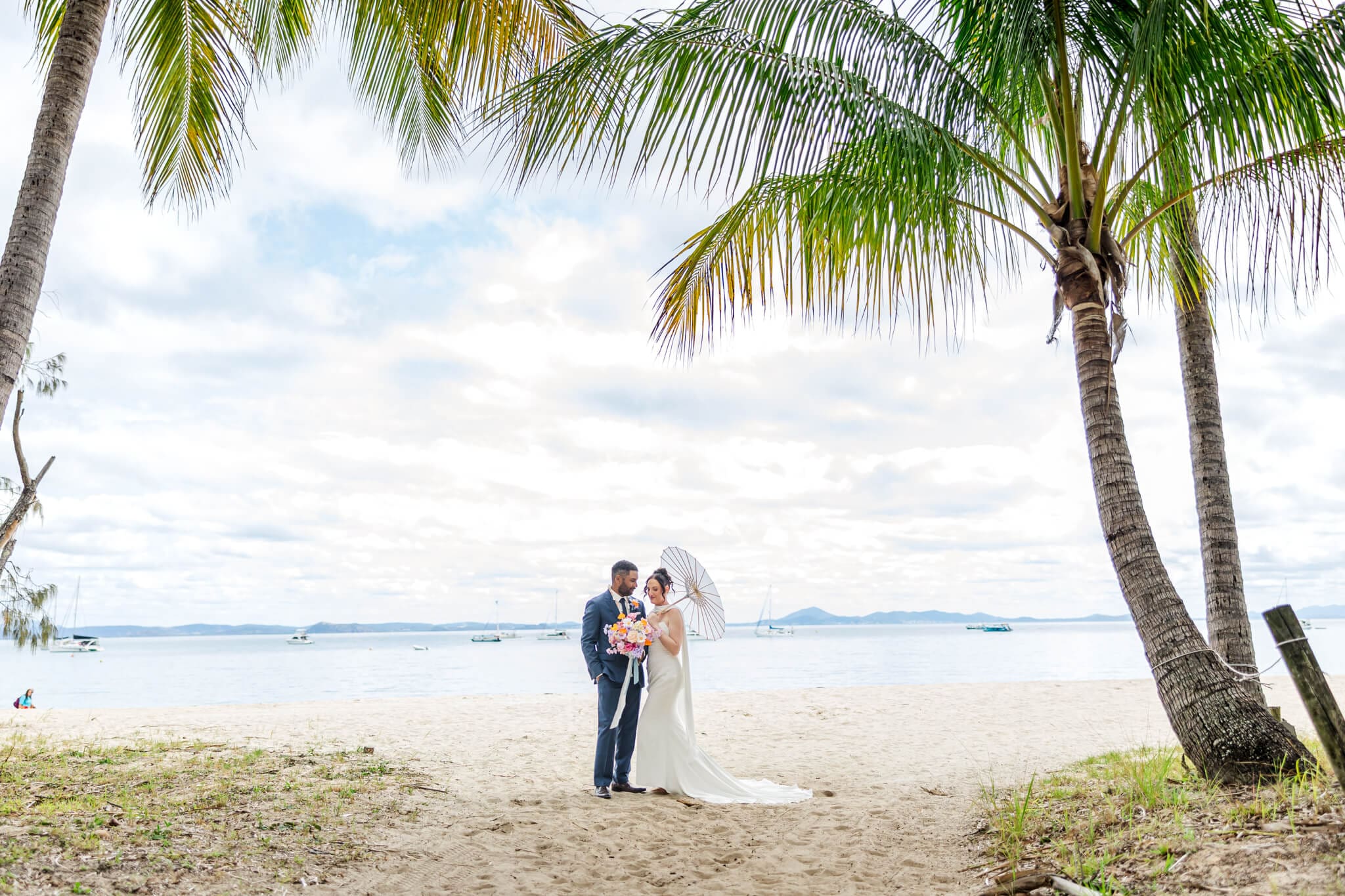 Bride and Groom share a moment on Great Keppel Island during their wedding day. Pictured in front of one of the beaches near Great Keppel Island Hideaway.