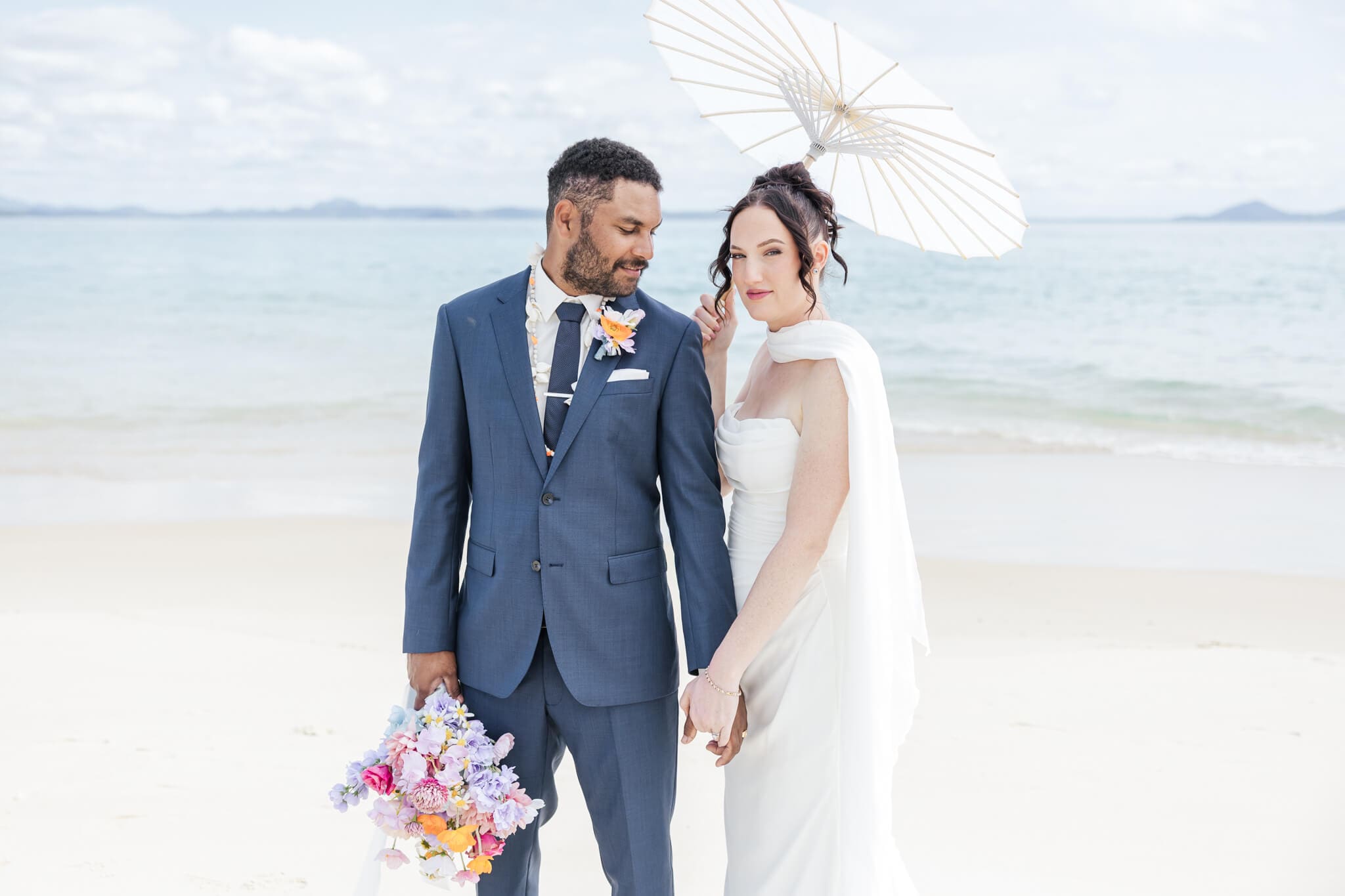 Bride and Groom enjoying the beaches near Great Keppel Island Hideaway. Photographed by Julie-Anne Photography.