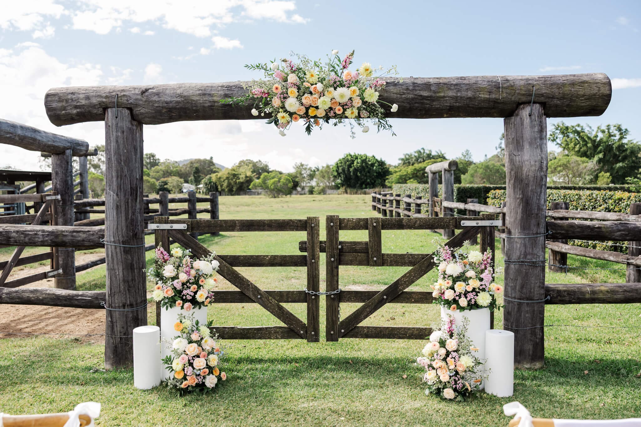 Ceremony area at The Paddock near Yeppoon. Luxury wedding venue, with yard rails as a feature.