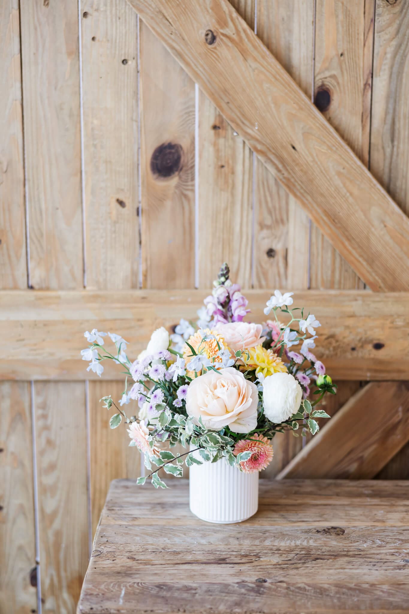 Floral decor at the entrance of the marquee at The Paddock Yeppoon, a wedding venue.