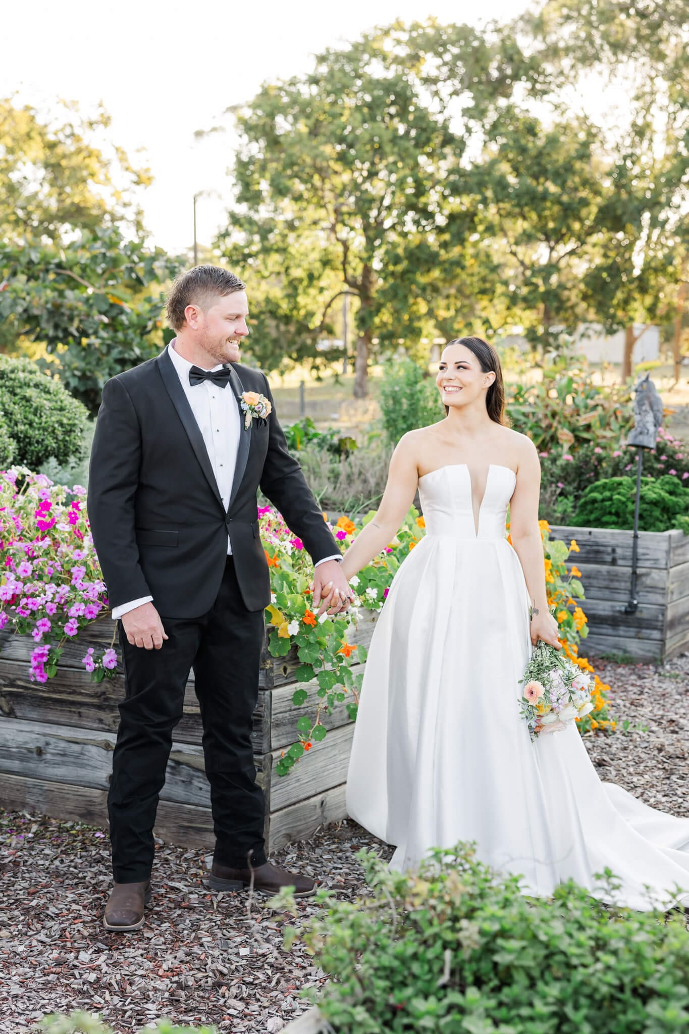 Stunning wedding portrait of bride and groom in the beautiful gardens at The Paddock Yeppoon. Captured by Julie-Anne Photography.