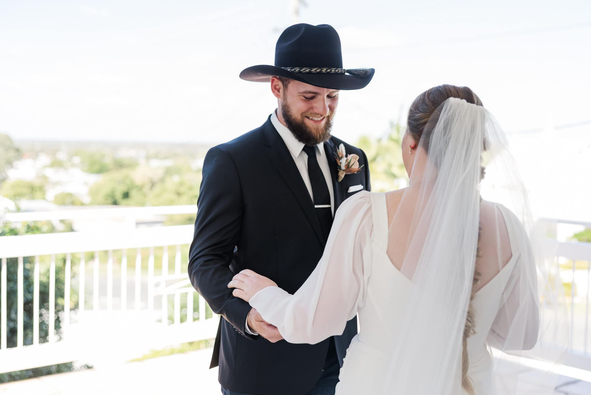 First look for a bride and groom in a luxury Airbnb before they go to their wedding ceremony site at Paradise Lagoons Rockhampton.