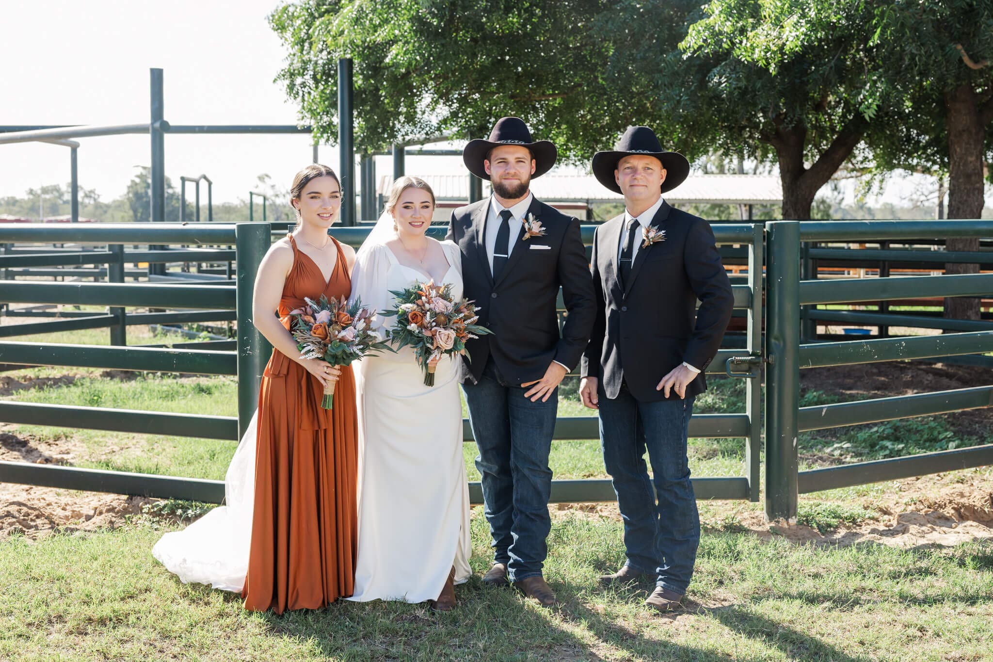 Bridal party portrait in front of the yards at Paradise Lagoons. 