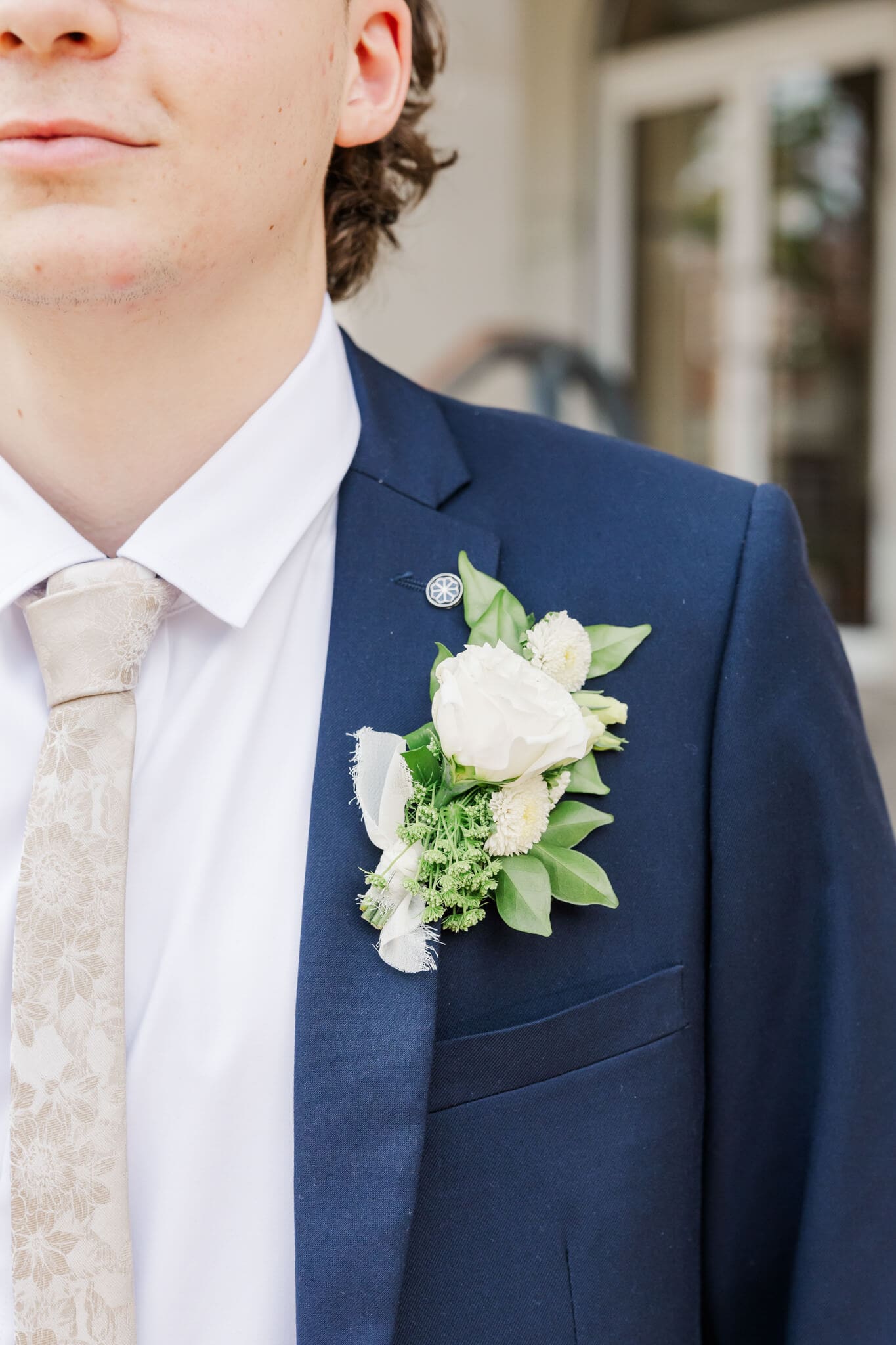 Detail shot of a corsage on a boy's suit on formal day. Florals created by Shannon Hawkes Rockhampton.