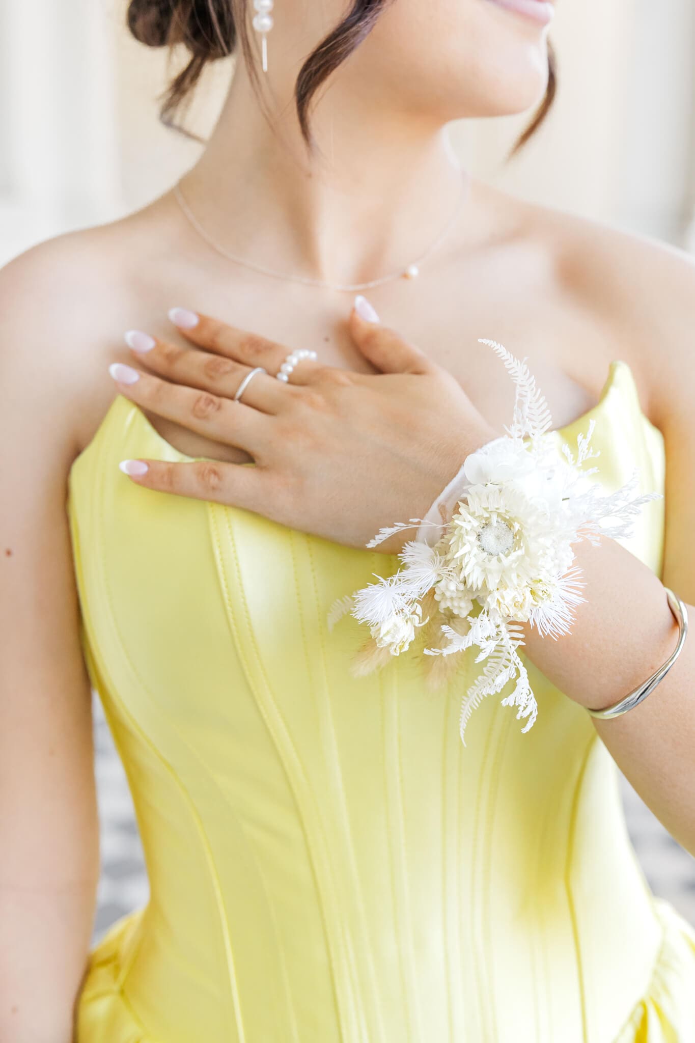A beautiful floral hand piece created by Shannon Hawkes Rockhampton on a graduate for her formal day.