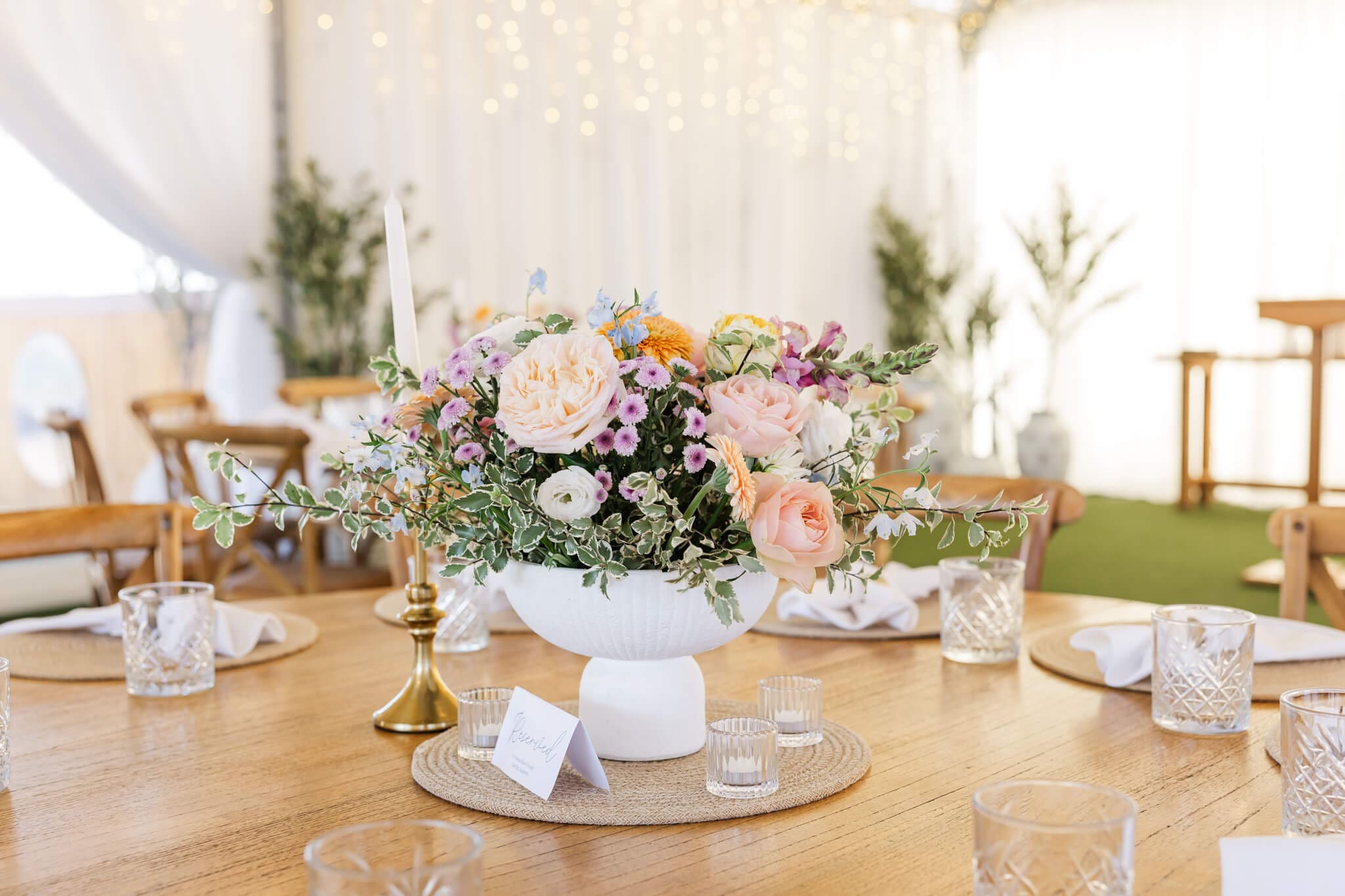 Capturing the wedding reception area in the style of editorial wedding photography style.