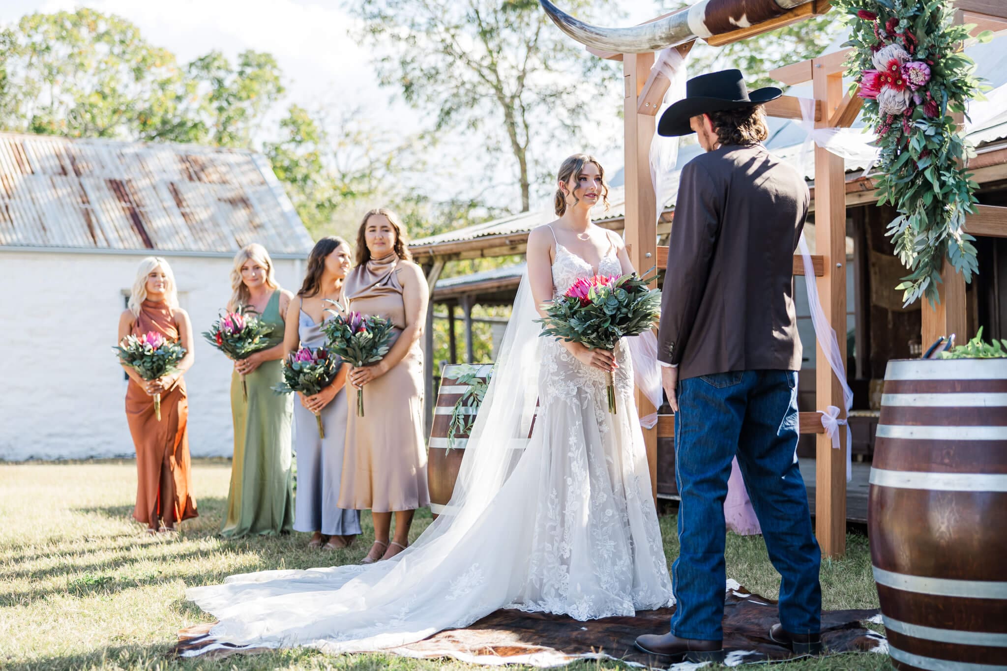 Bride and Groom getting married at the Glenmore Homestead Rockhampton in front of the old homestead.
