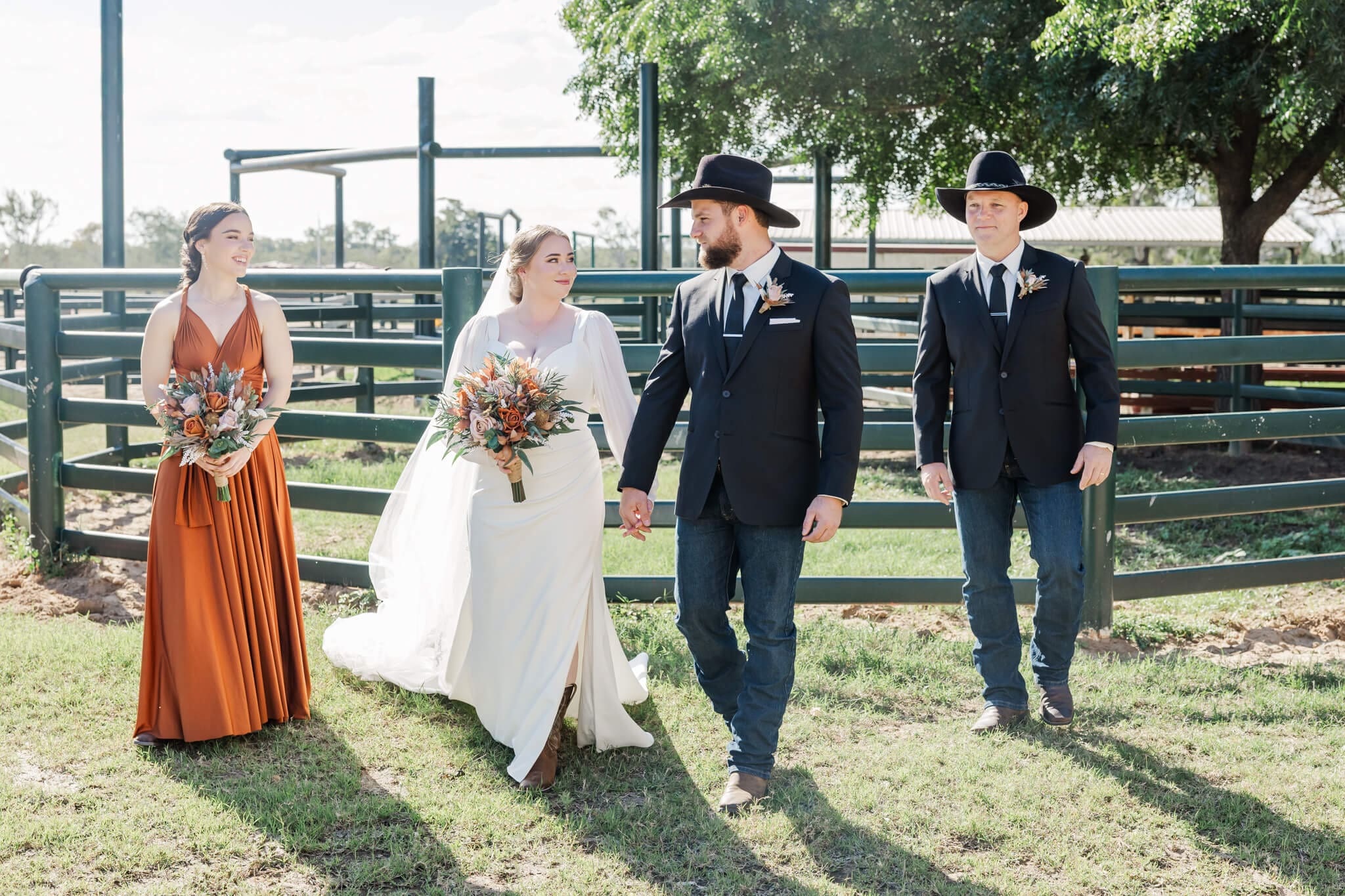 Candid bridal portrait of the group walking towards the camera at one of Rockhampton wedding venues.