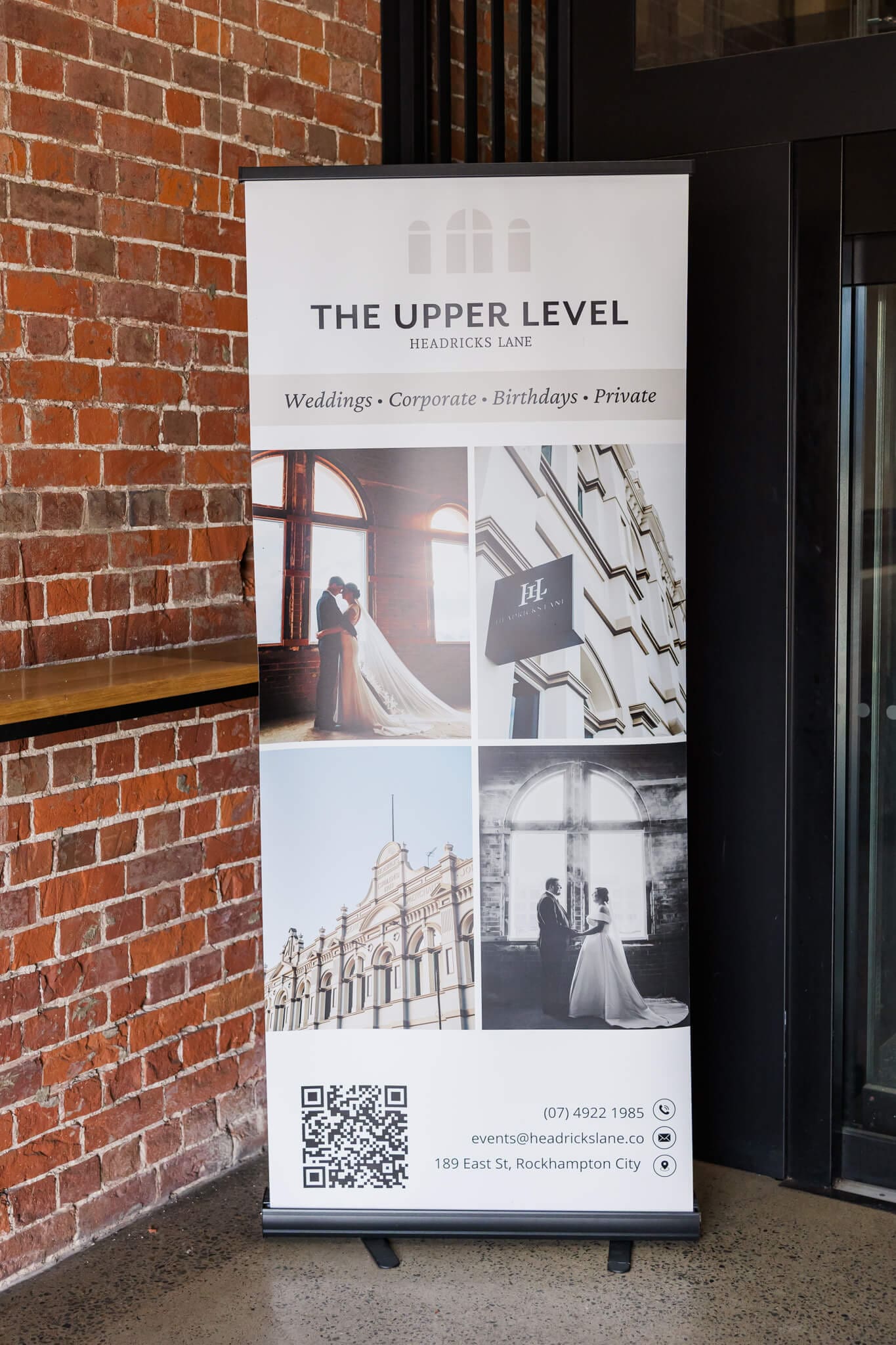 A sign at Headricks Lane showcasing their wedding reception options on the Upper Level.