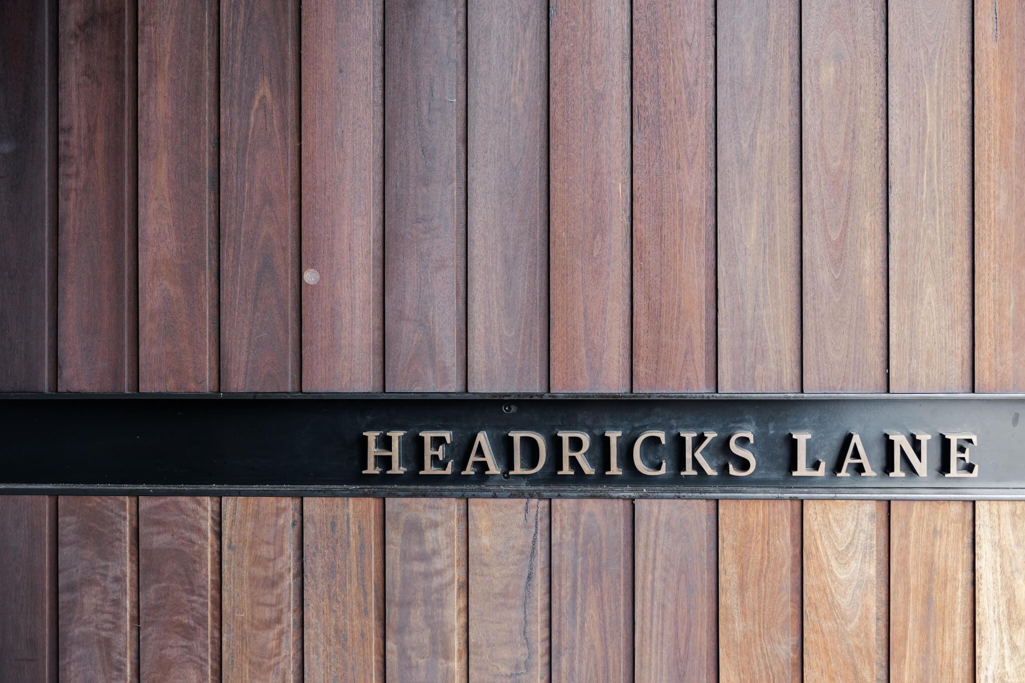 Wooden front door leading into a Rockhampton wedding venue called Headricks Lane.