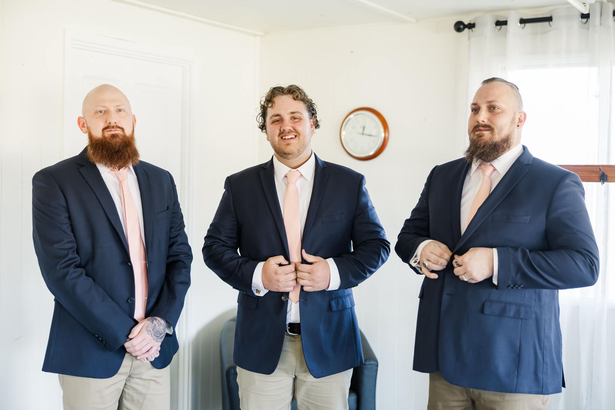 Groomsmen prepare for a wedding day at Old Station Raglan.