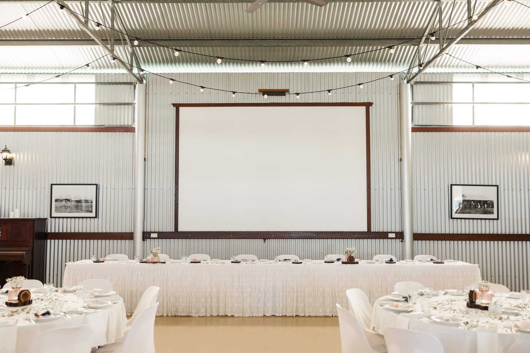 Bridal table at a wedding reception held in a huge hanger in Queensland, Australia
