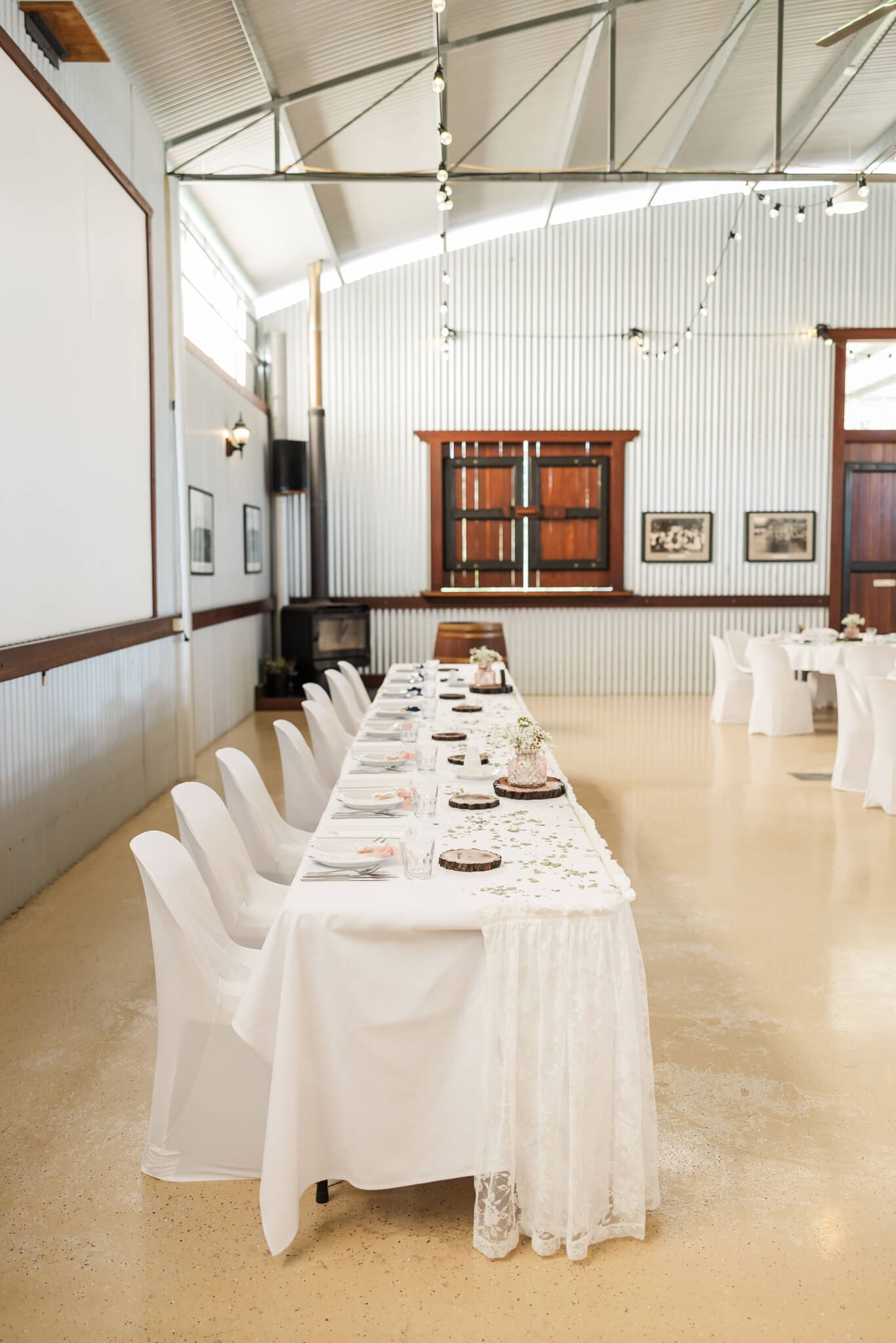 Bridal table at a wedding reception held in a huge hanger in Queensland, Australia