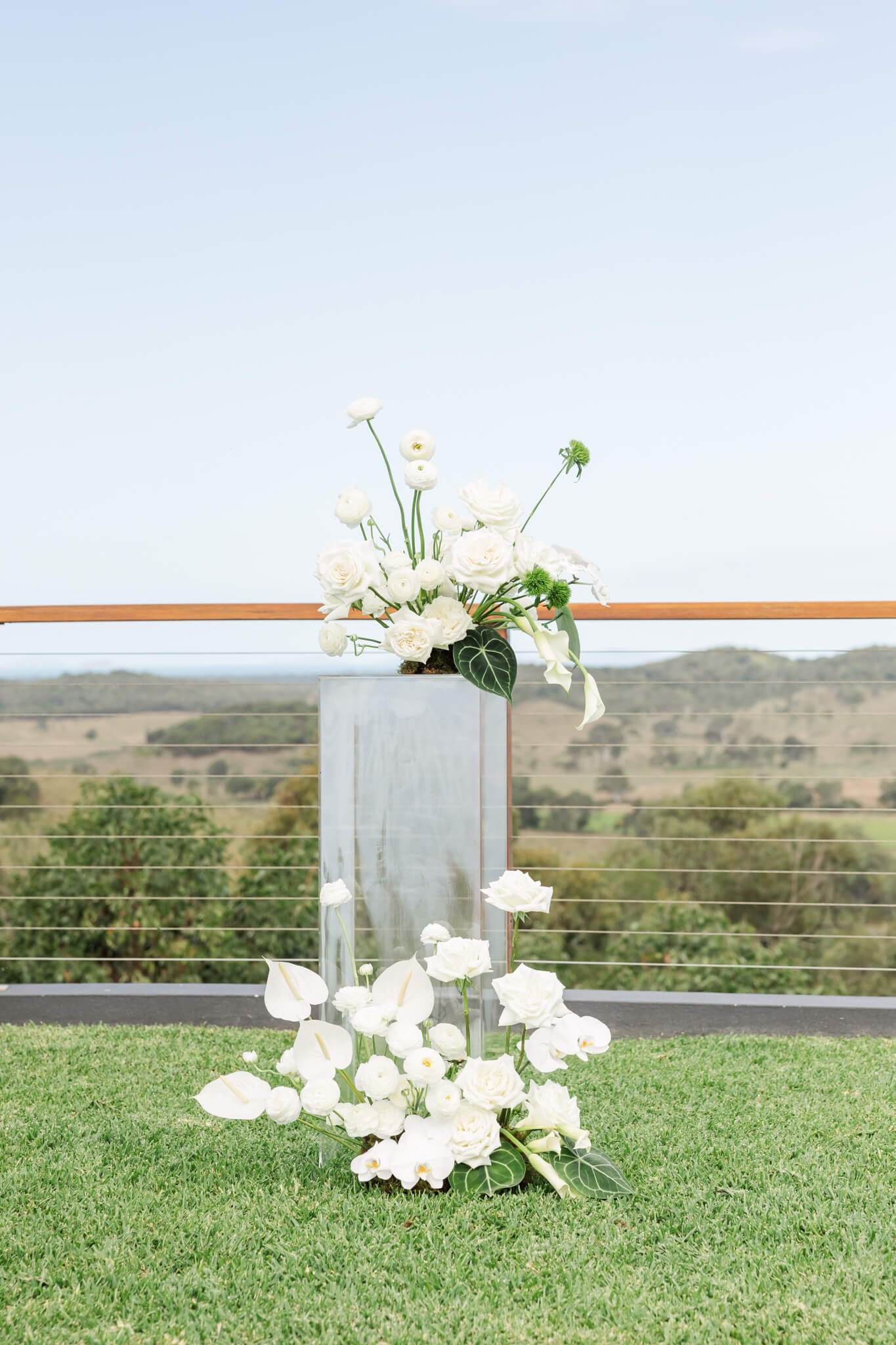 Floral arrangements on a hire item, ready for a wedding ceremony