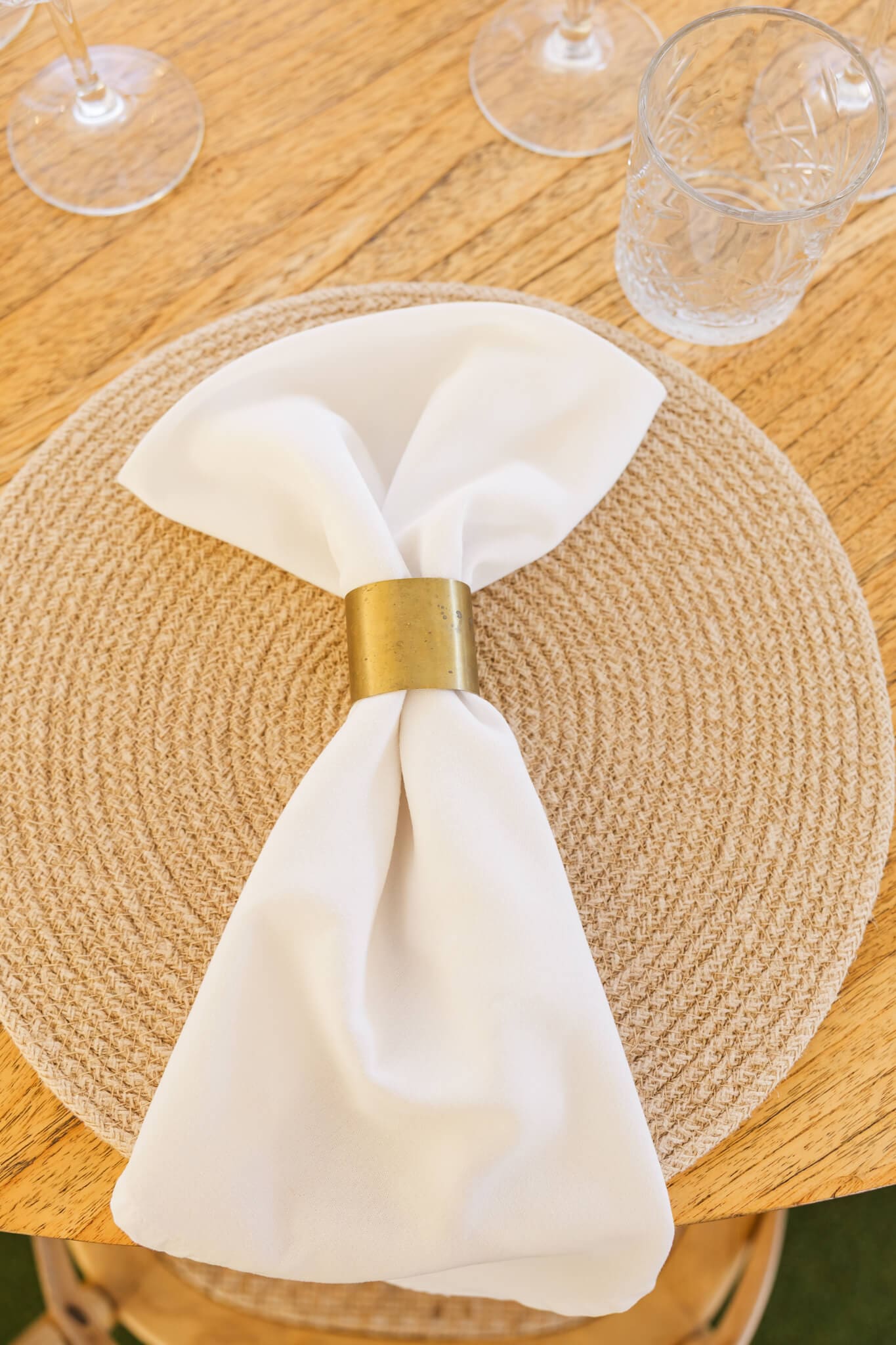 a cream napkin with a gold napkin ring. Created by Little List + Co who a wedding hire Rockhampton option.