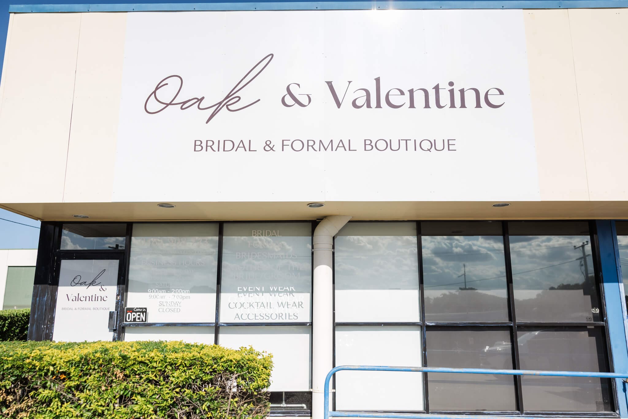 Store front to Oak and Valentine in Rockhampton, a bridal and formal dress store.