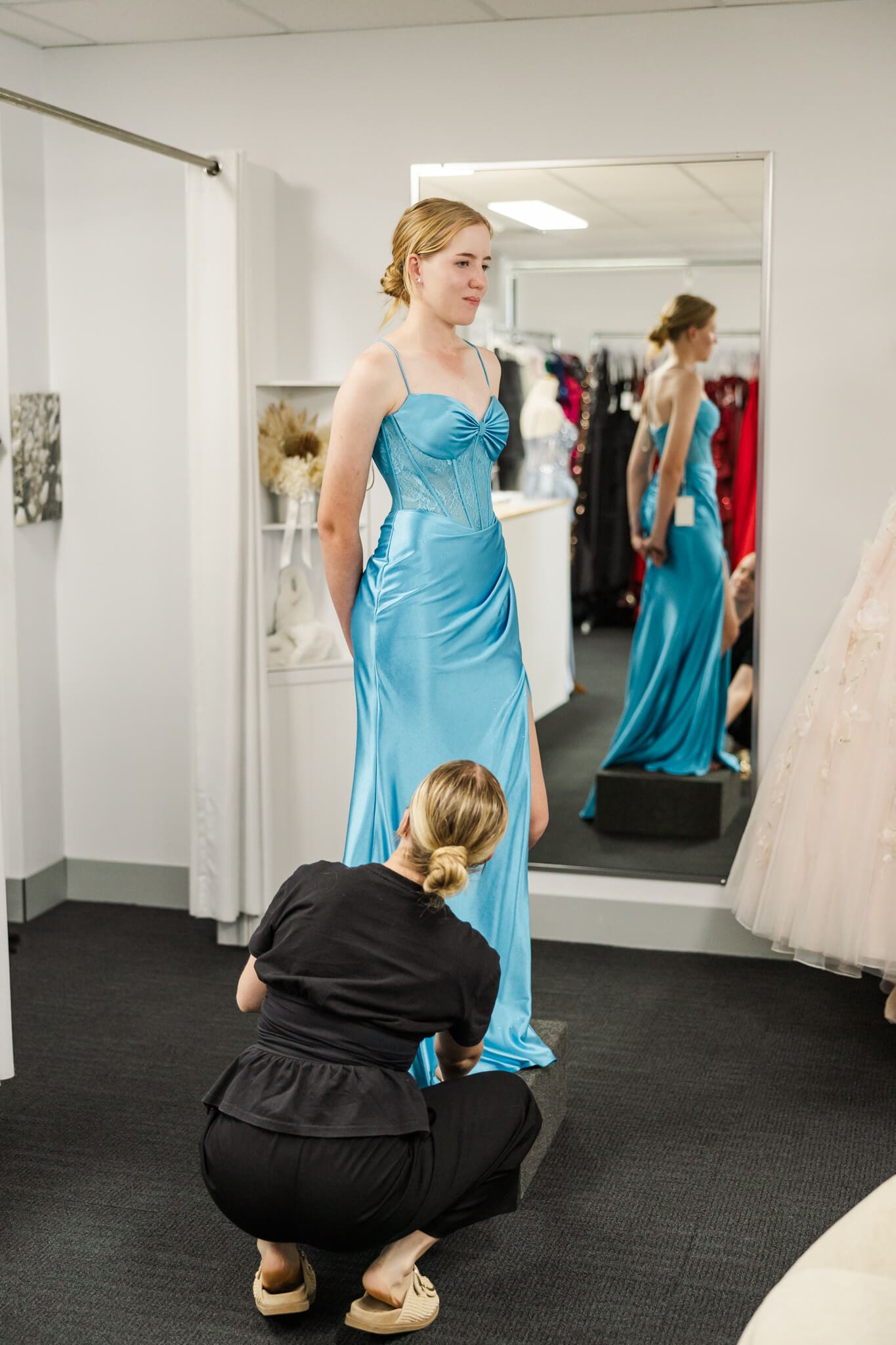 Formal graduate try's on a teal blue dress from Oak and Valentine, Rockhampton.