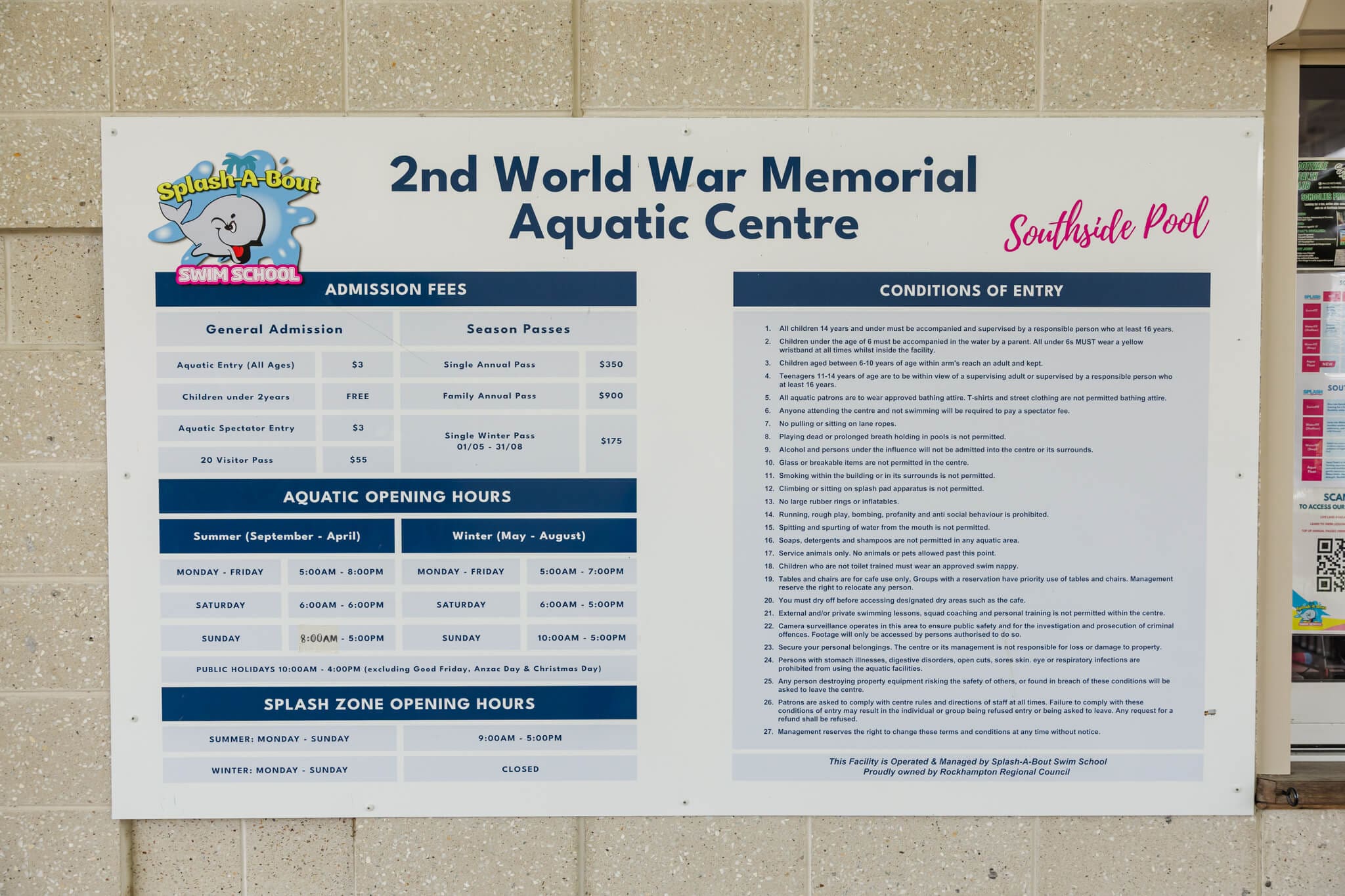 Information sign with opening times and prices at the Northside Rockhampton pool.