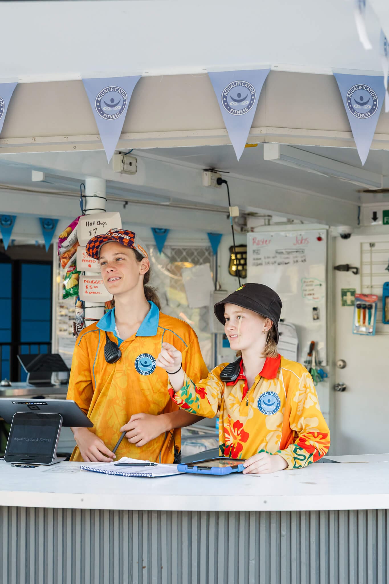 Friendly staff at a reception desk at Northside Pool